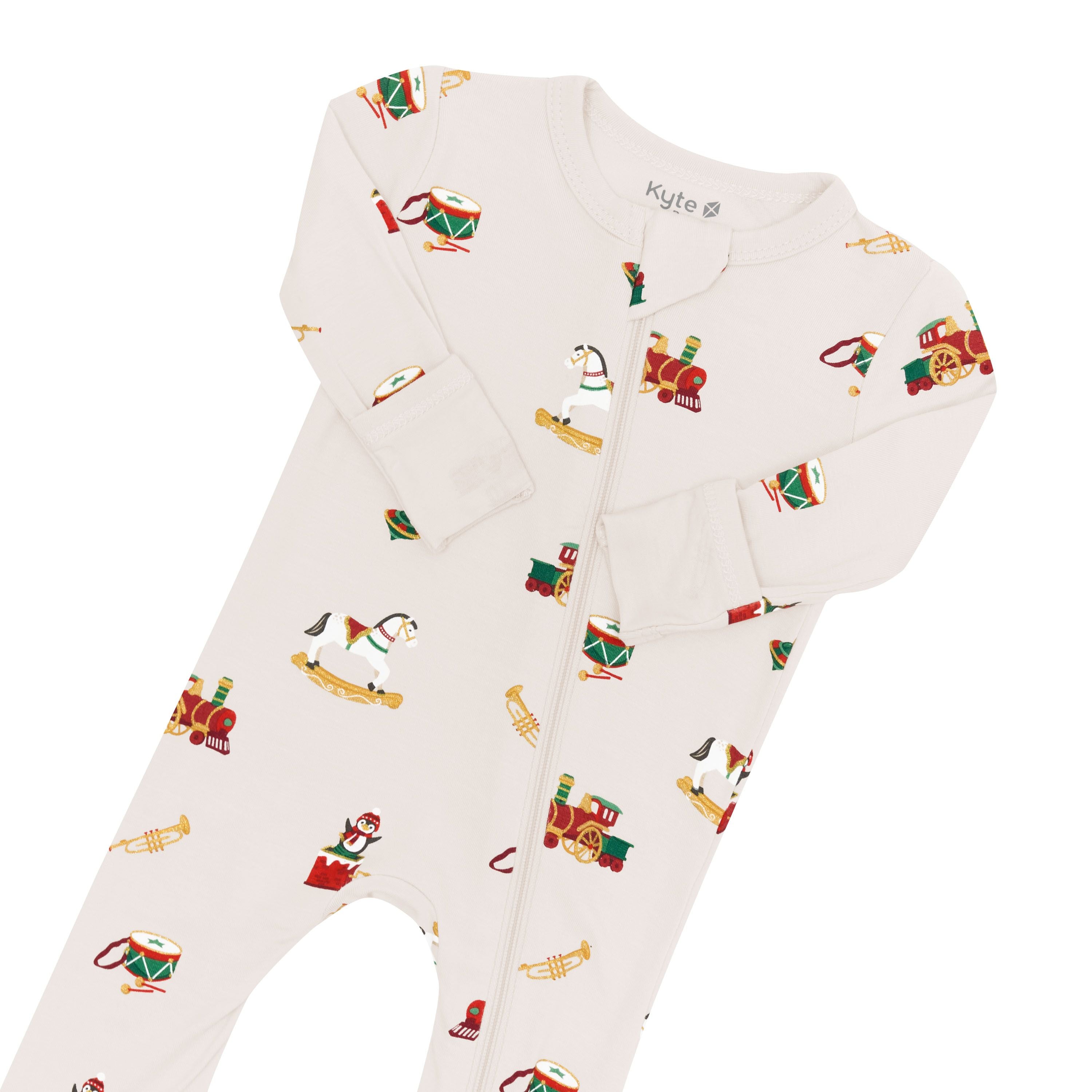 Close up of the zipper garage, zipper track and fold over hand cuffs shown on the Zippered Romper in Vintage Toys