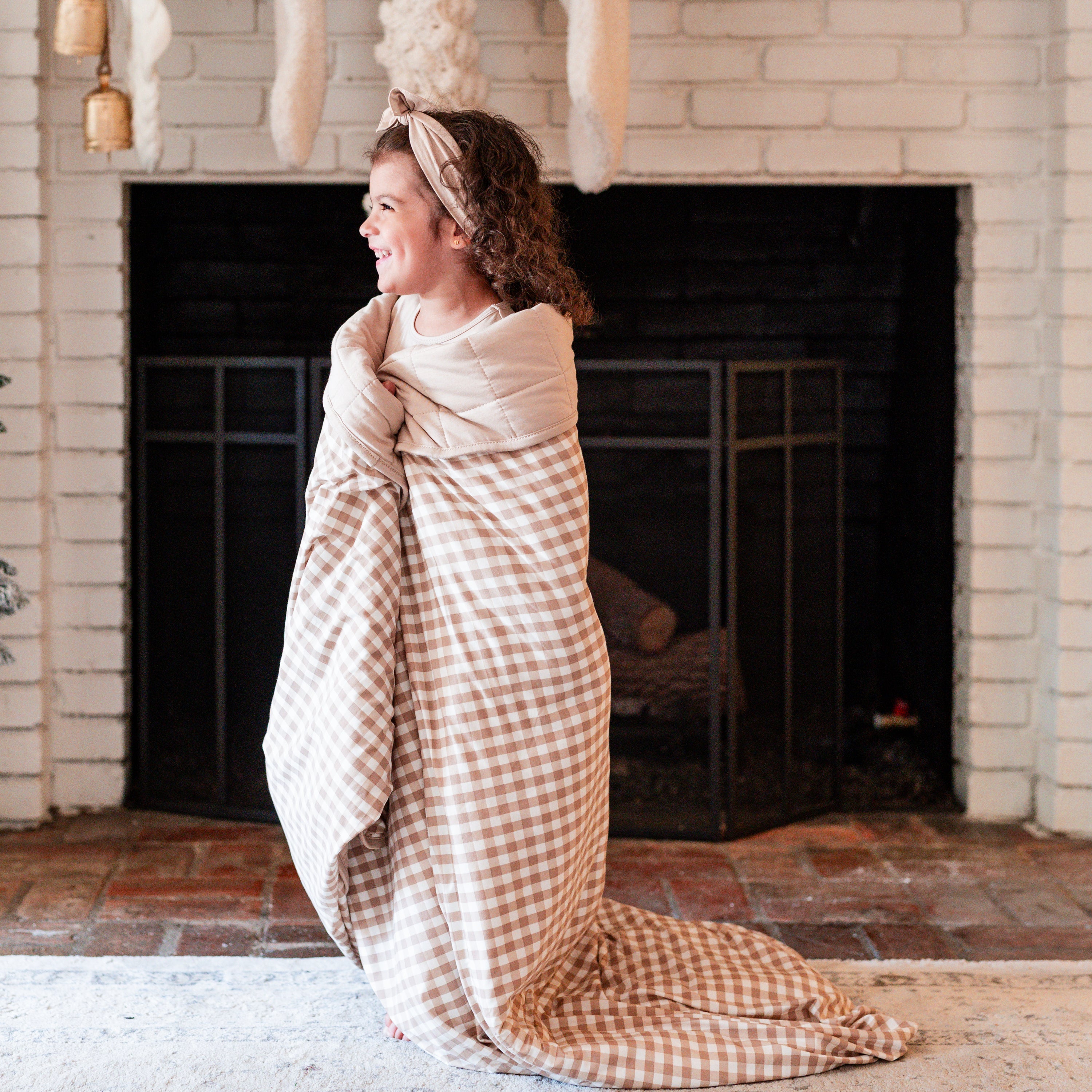 Girl wrapped in Youth Blanket in Gingham Bisque 2.5 TOG
