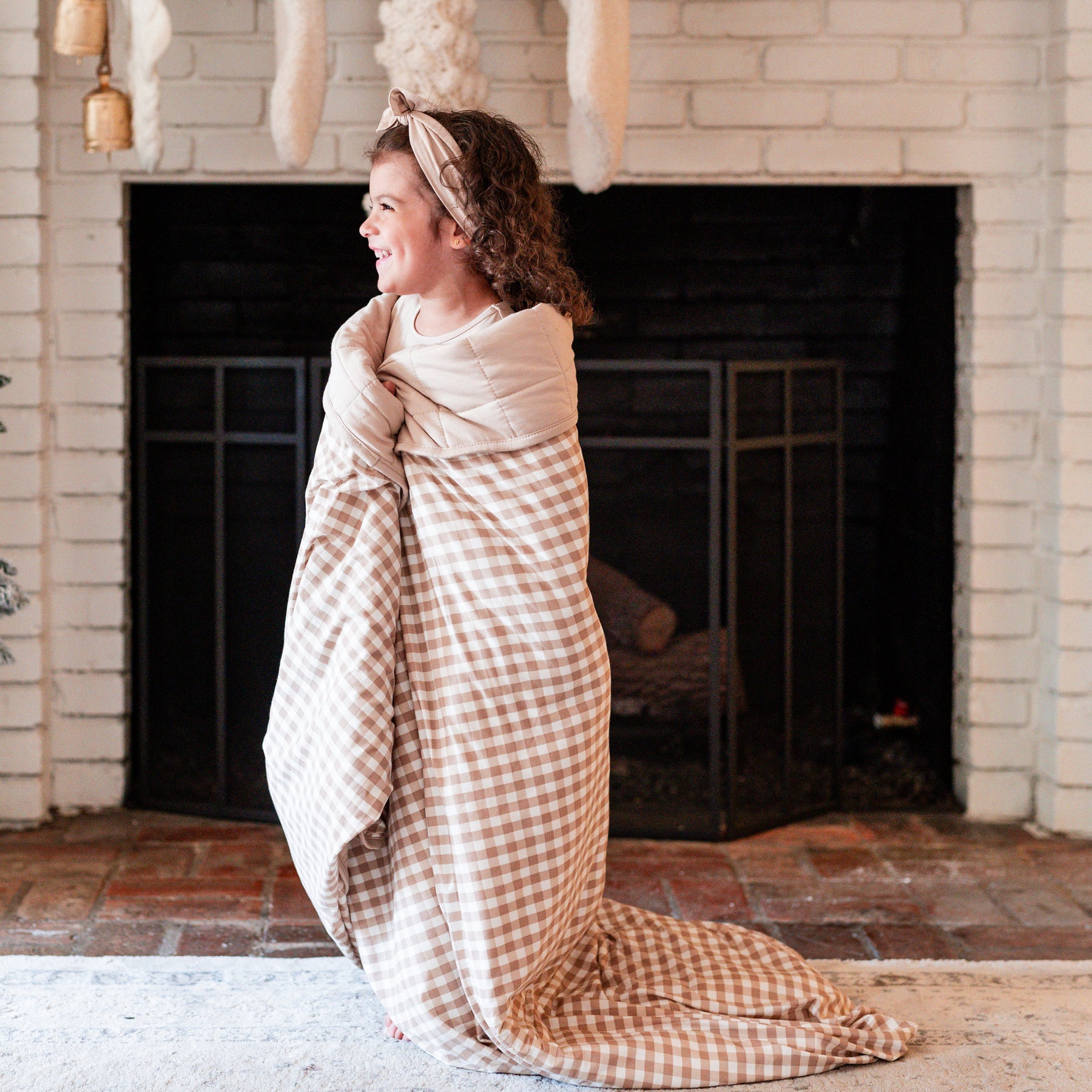 Girl wrapped in Youth Blanket in Gingham Bisque 2.5 TOG