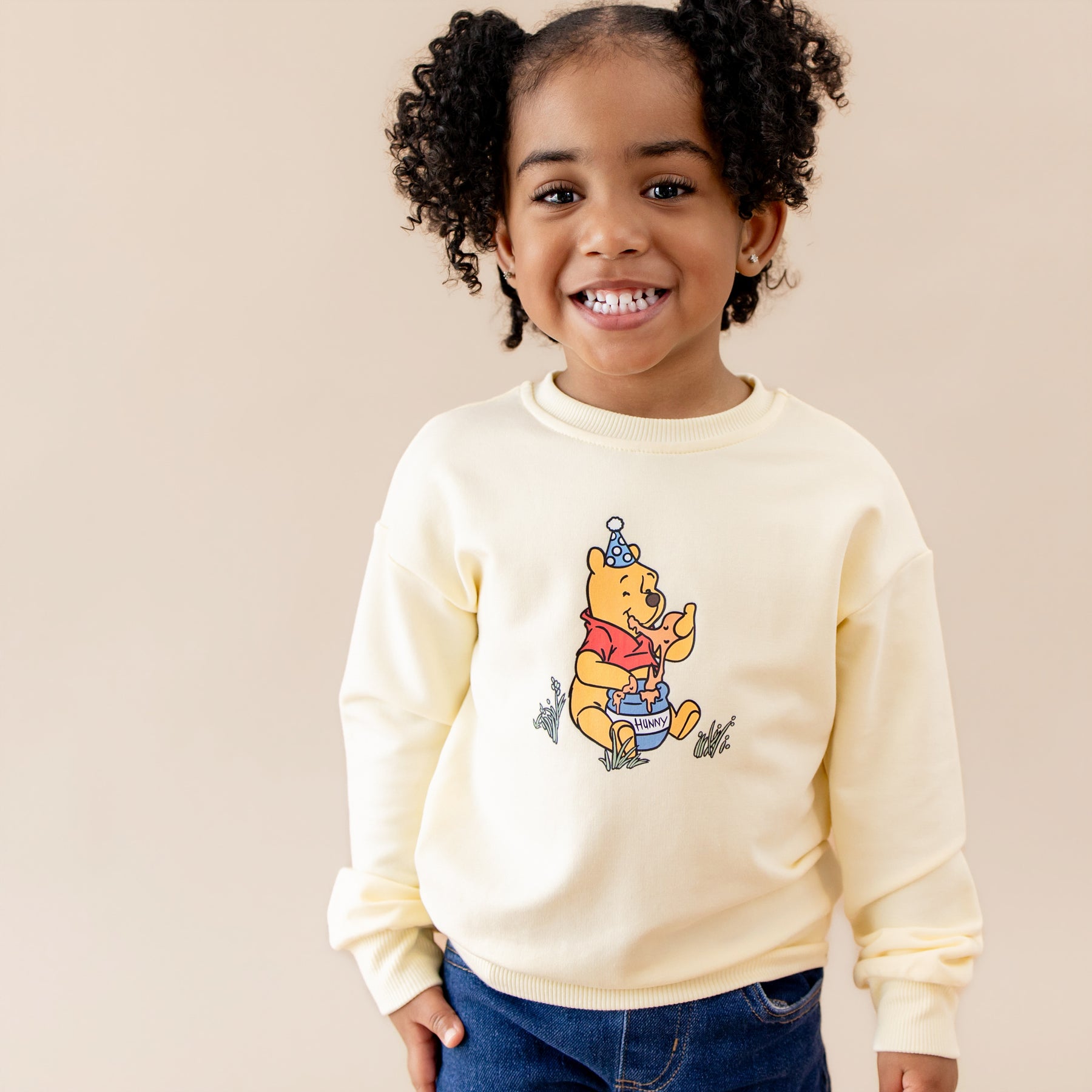 Close of up of the Sweatshirt in Winnie the Pooh on Chamomile shown on a young girl