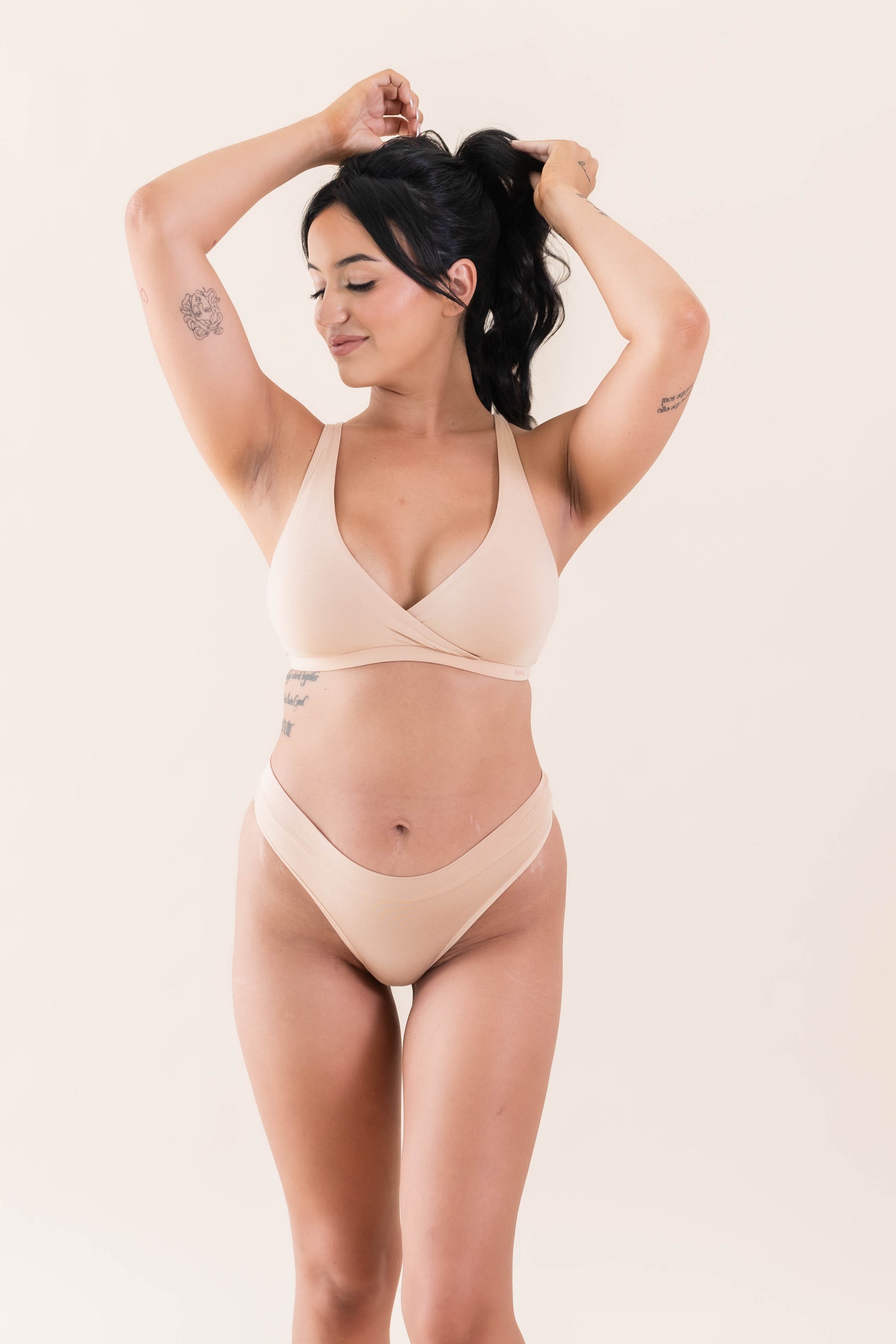 Female modeling the Women's Cross Front Bralette in Chai with matching underwear