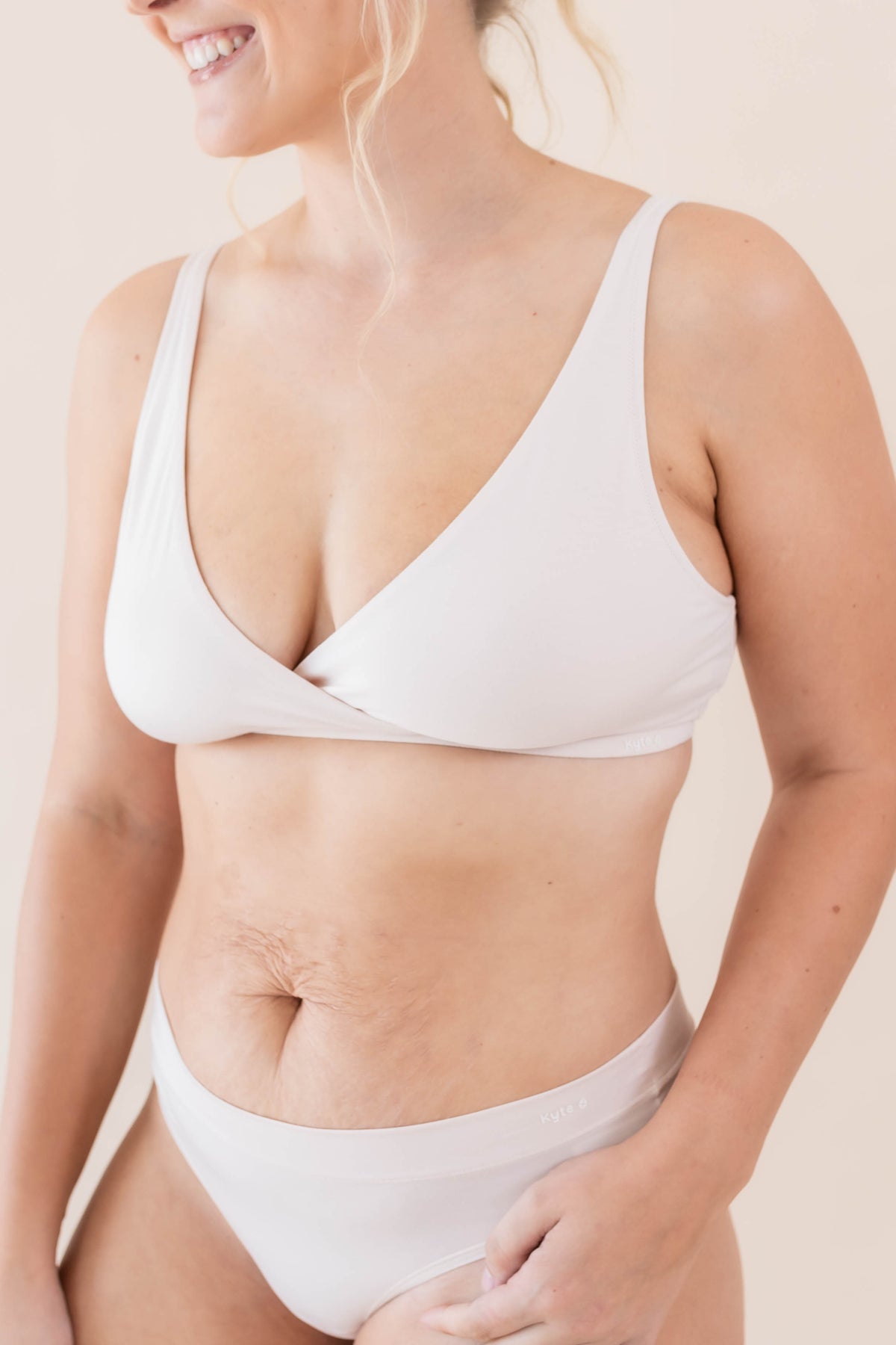 Model wearing the Women's Cross Front Bralette in Blonde with matching underwear