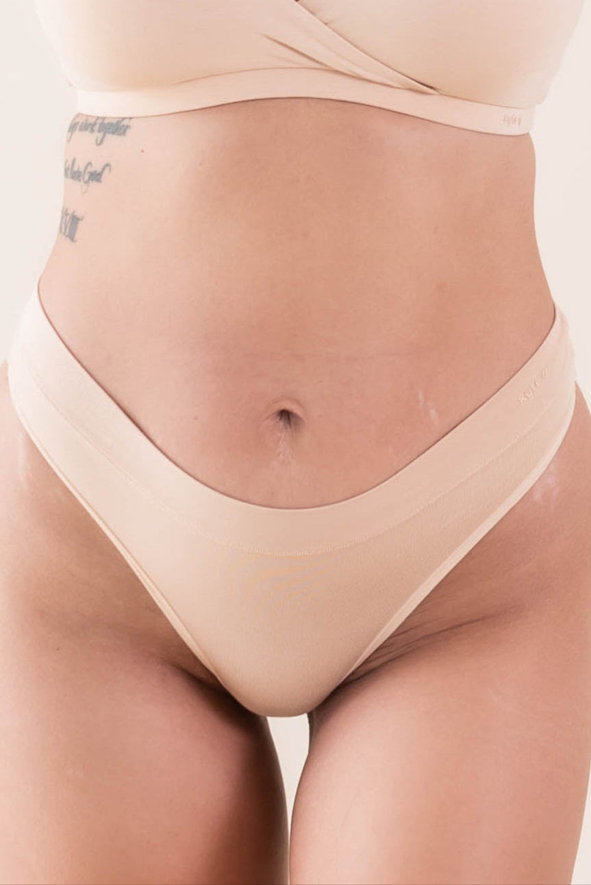 Close up of the front of the Women's Thong in Chai shown on a model