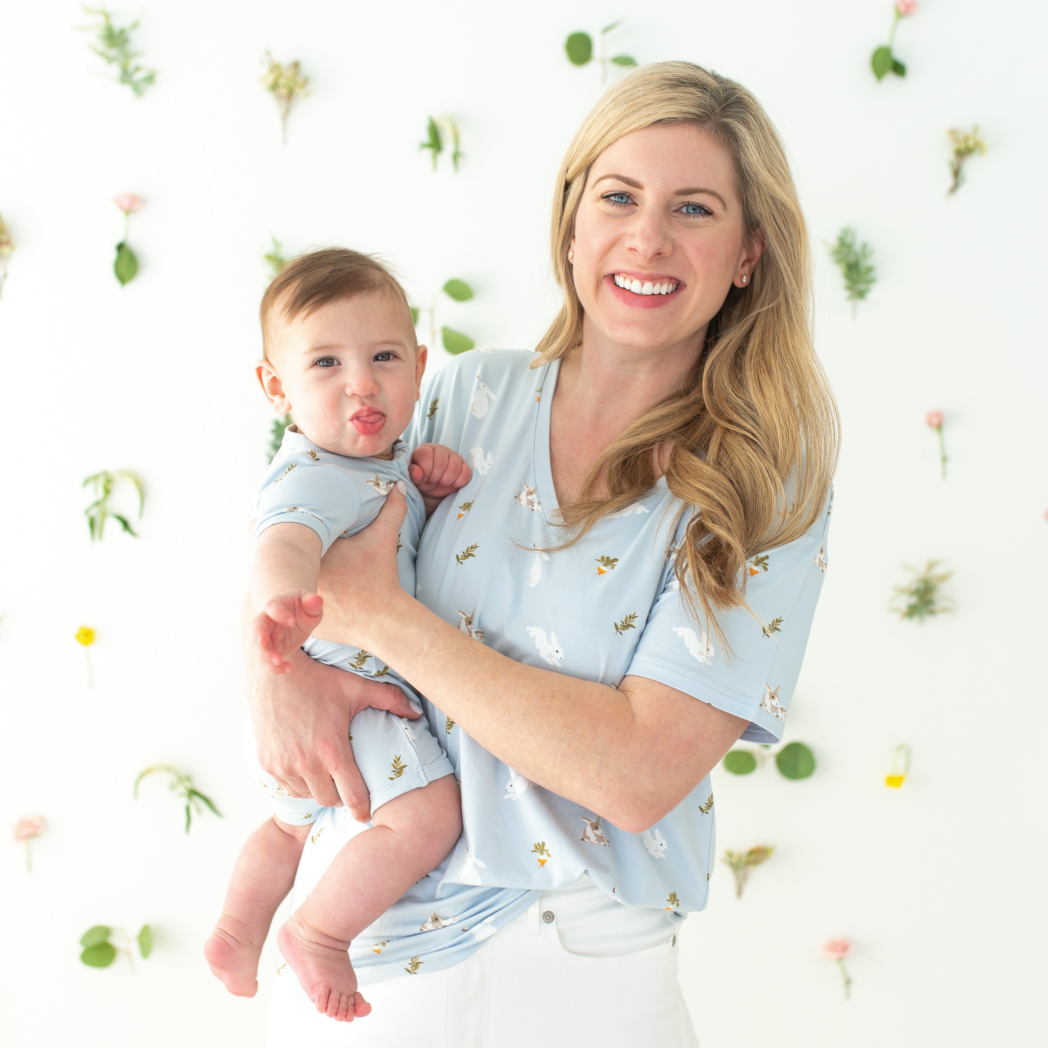 Mom wearing Women’s Relaxed Fit V-Neck in Ice Rabbit holding baby