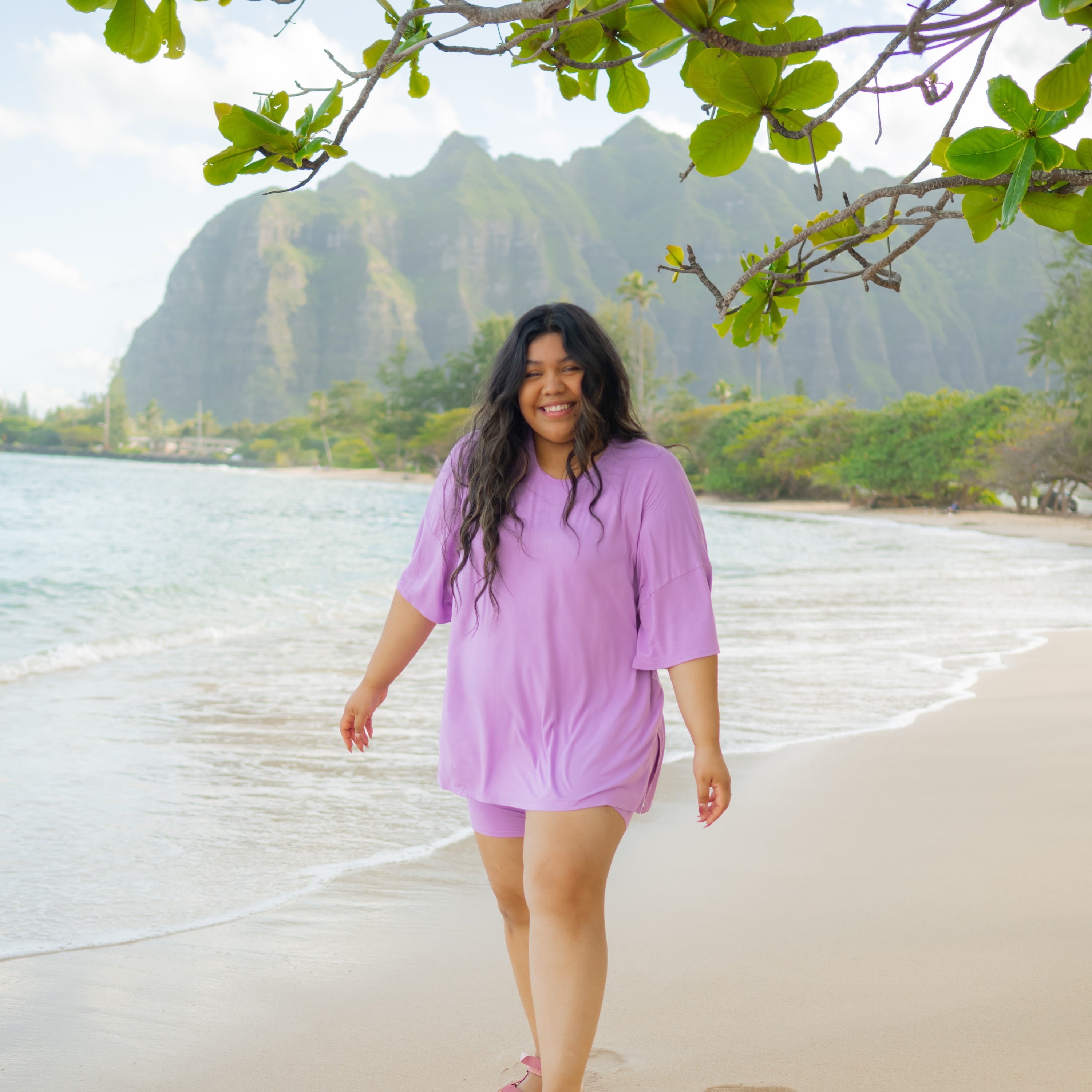 Woman modeling Women’s Biker Short Set in Poi on beach