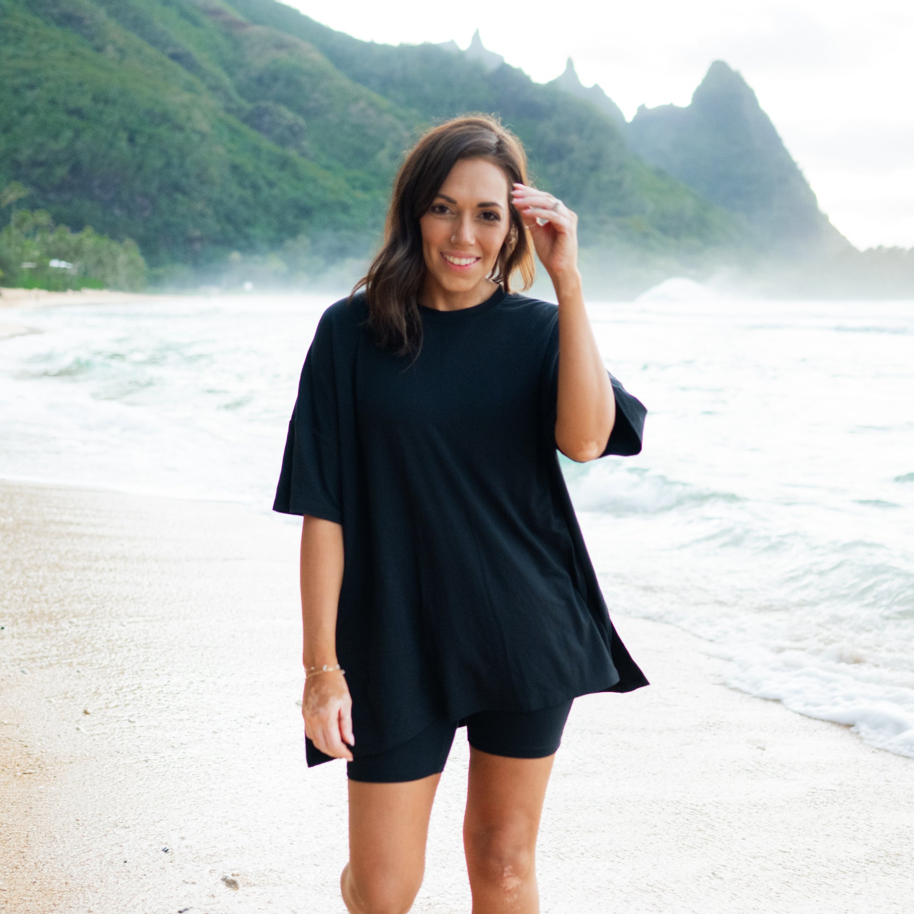 Woman modeling Women’s Biker Short Set in Midnight on the beach