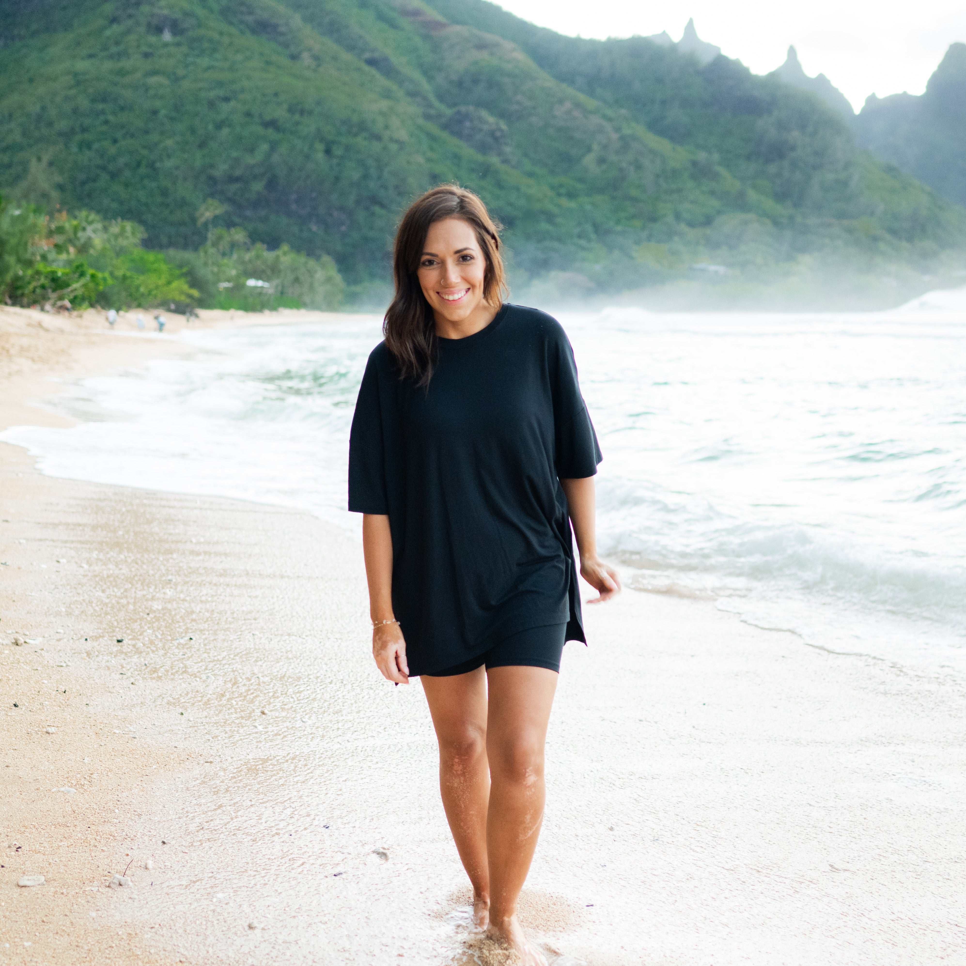 Woman modeling Women’s Biker Short Set in Midnight on the beach