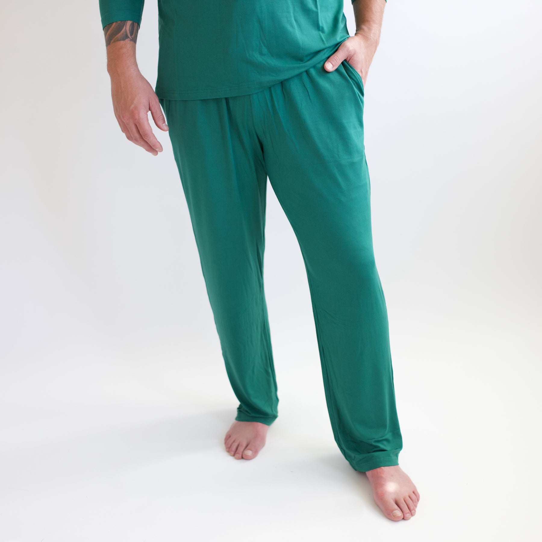 Male model walking wearing the Men's Lounge Pants in Emerald