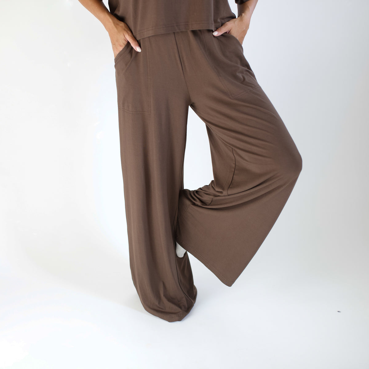 Brown outfit with wide-leg pants on a white background