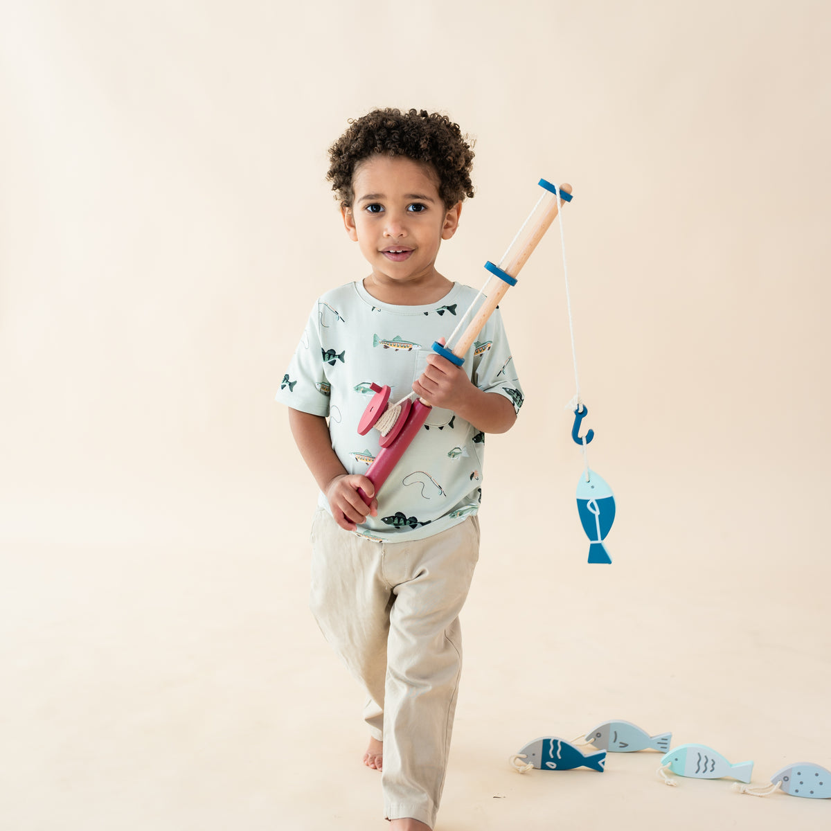 toddler wearing Toddler crew neck tee in fishing while holding toy fishing pole