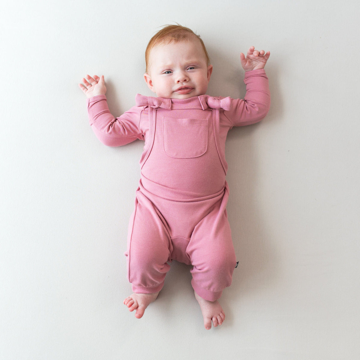 Kyte Baby Baby Overall Bamboo Jersey Overall in Apple Blossom