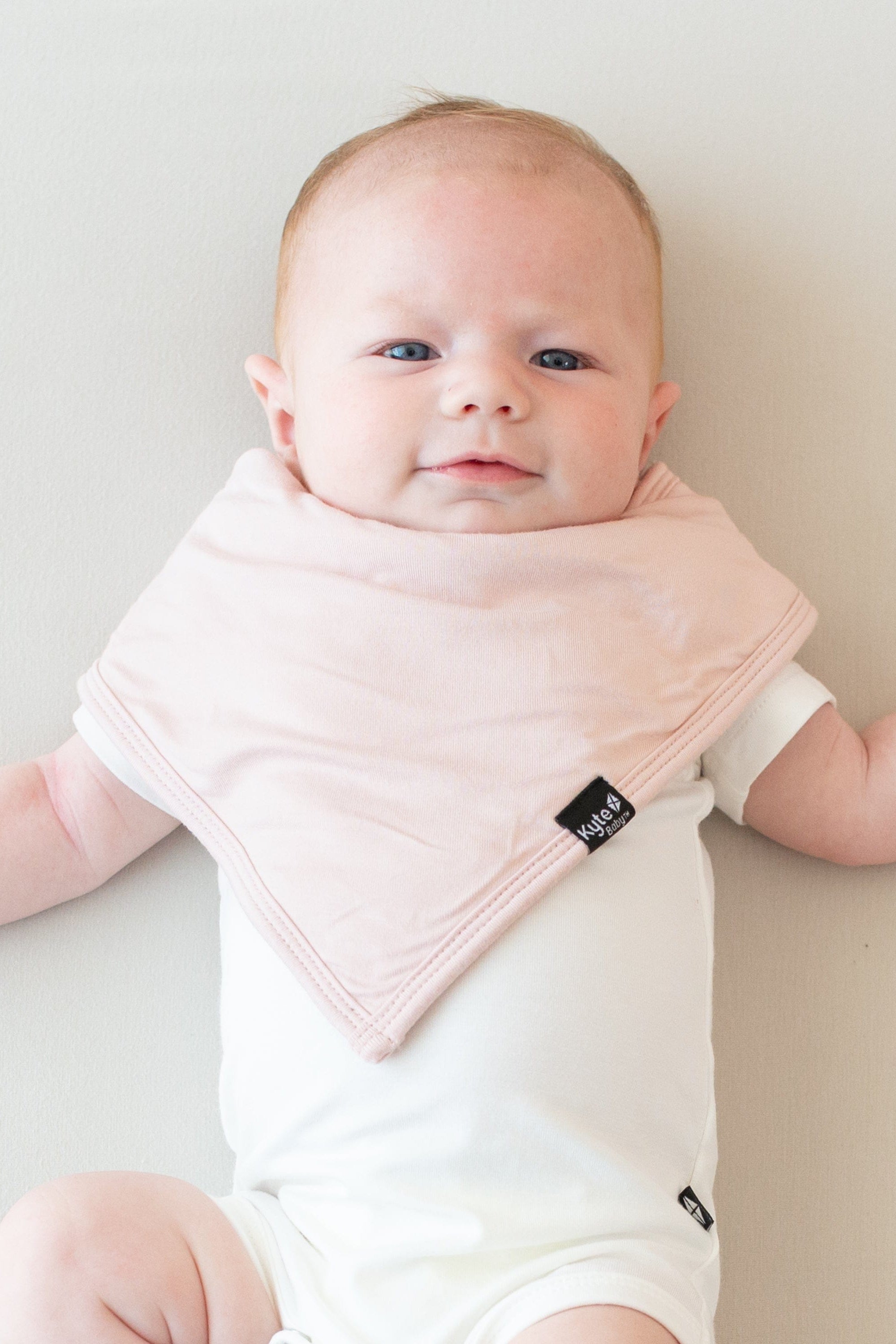 Infant wearing a Bib in Blush and Short Sleeve Bodysuit in Cloud