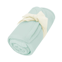 Rolled up Burp Cloth in Sage with bow tied around it