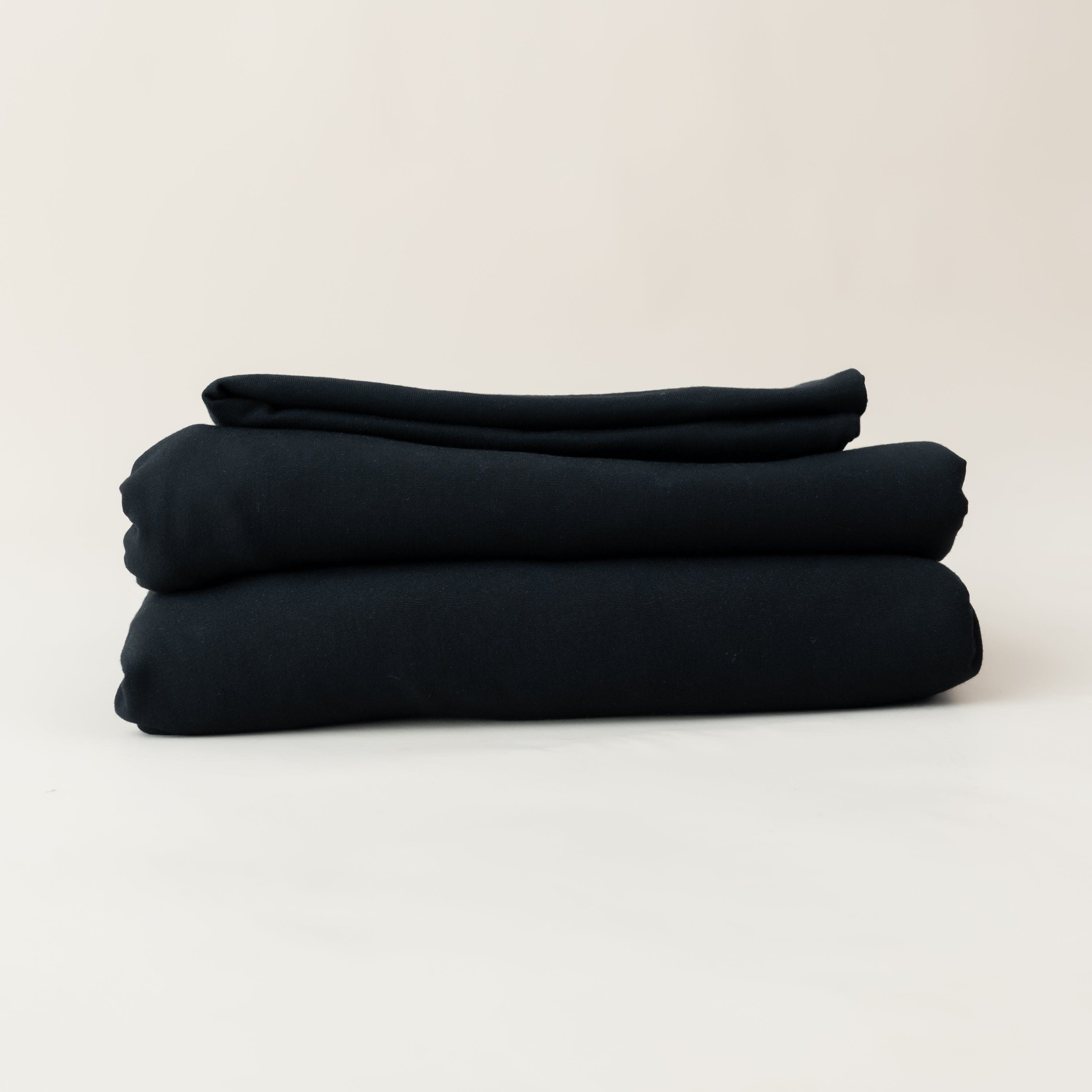 Folded Kyte Baby Fitted Sheet with Pillowcases in Midnight