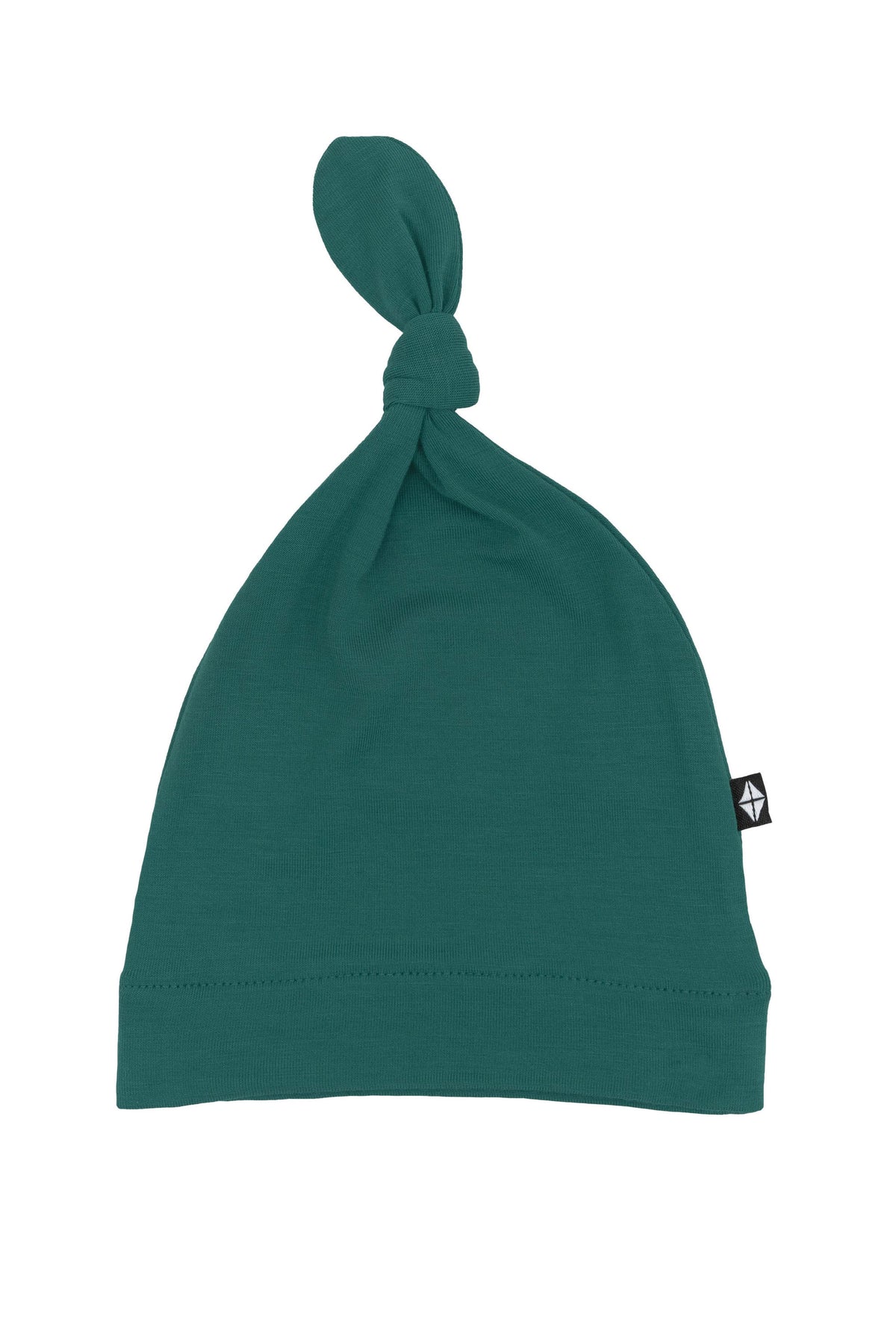 Flat lay of Kyte Baby Knotted Cap in Emerald
