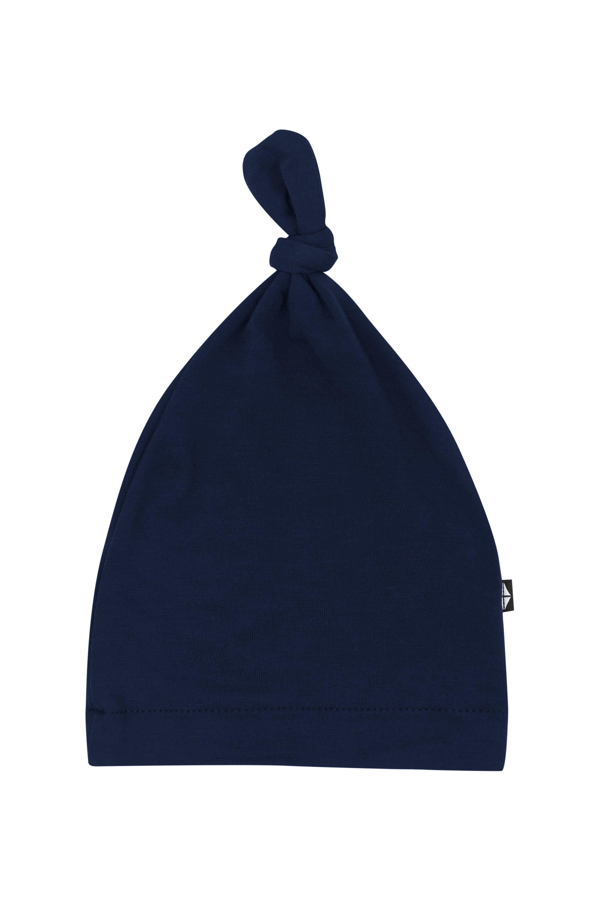 Flat lay of Kyte Baby Knotted Cap in Navy