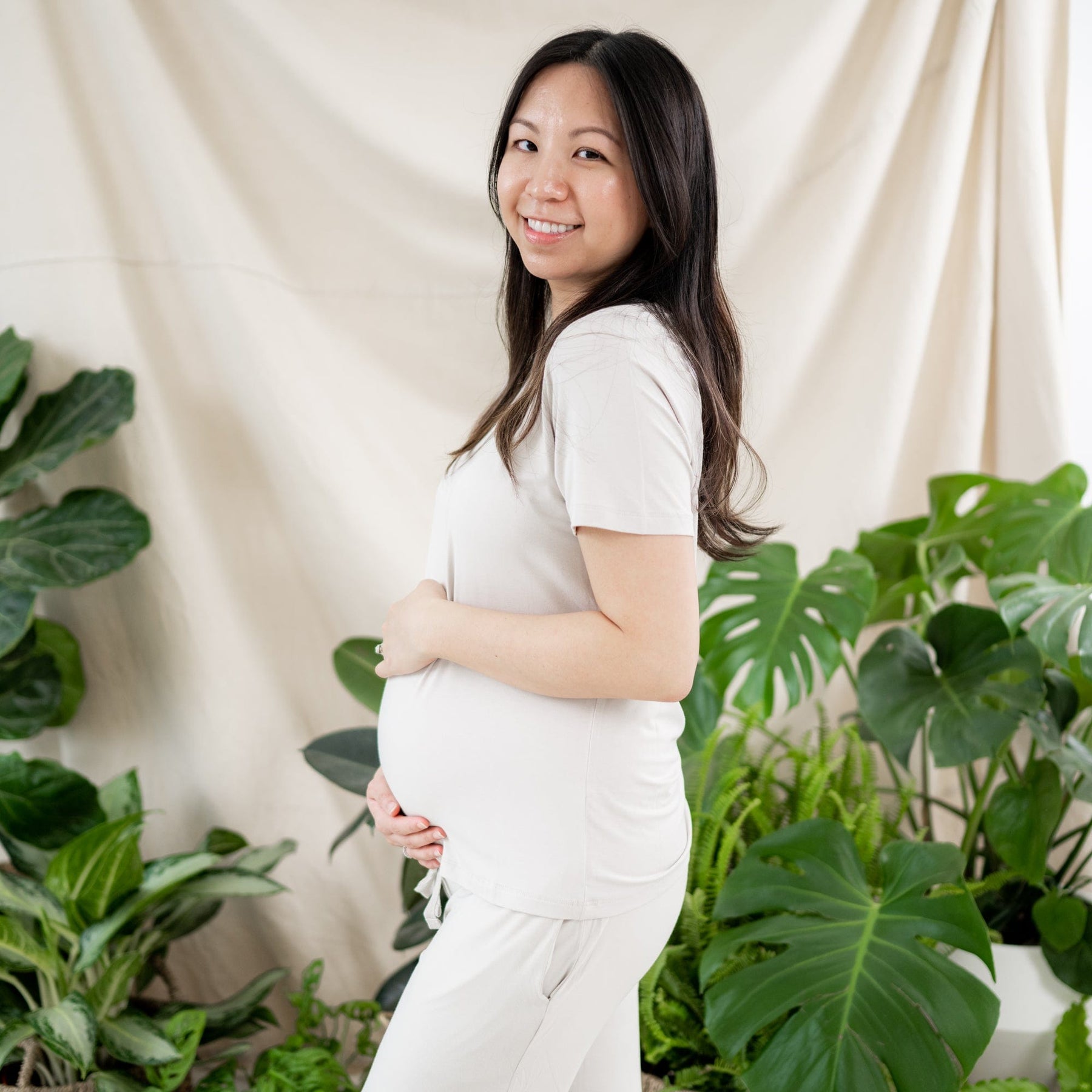 Mother wearing Kyte Baby Women's relaxed fit Lounge Pants and shirt in Oat