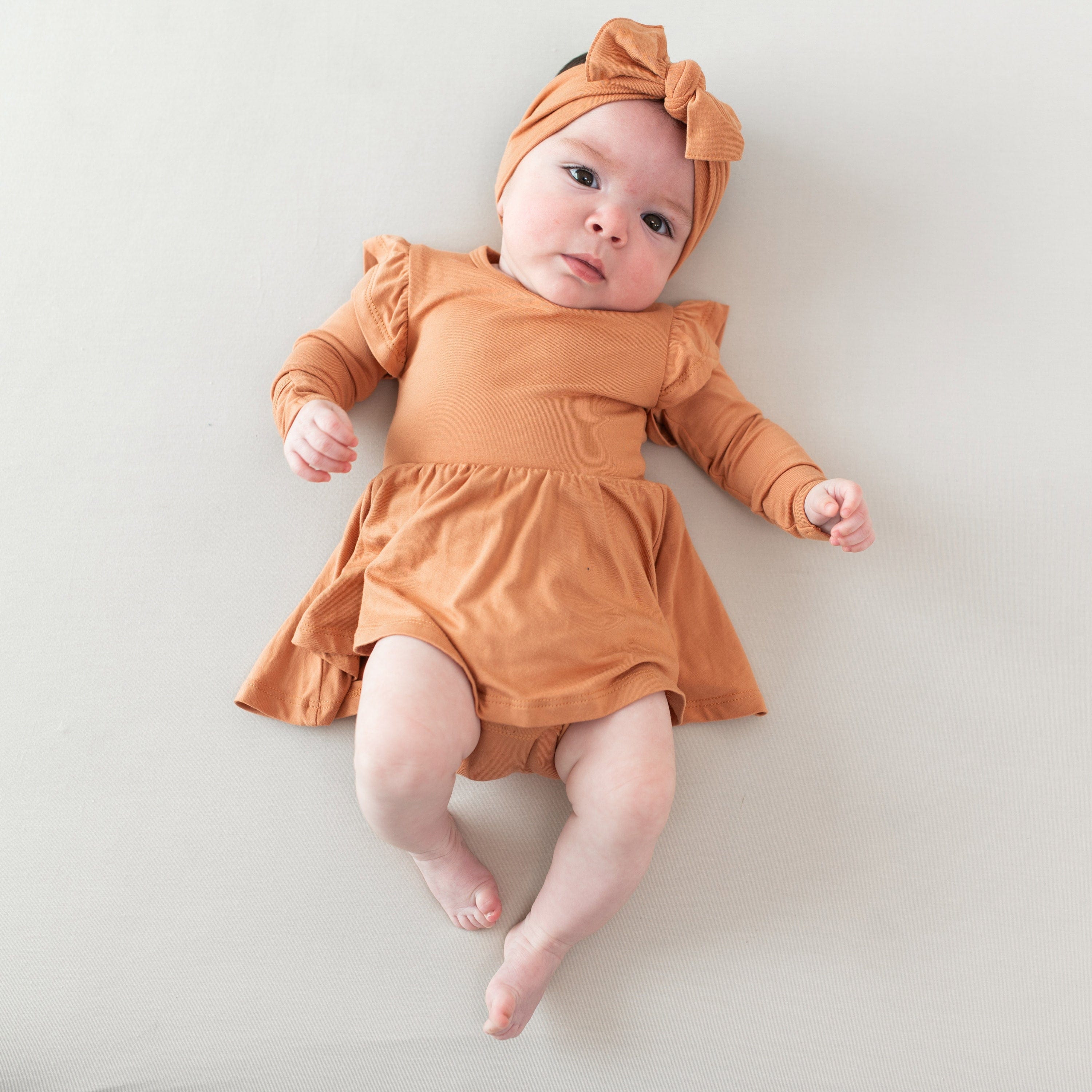 Kyte Baby LS Twirl Bodysuit Dress Long Sleeve Twirl Bodysuit Dress in Apricot