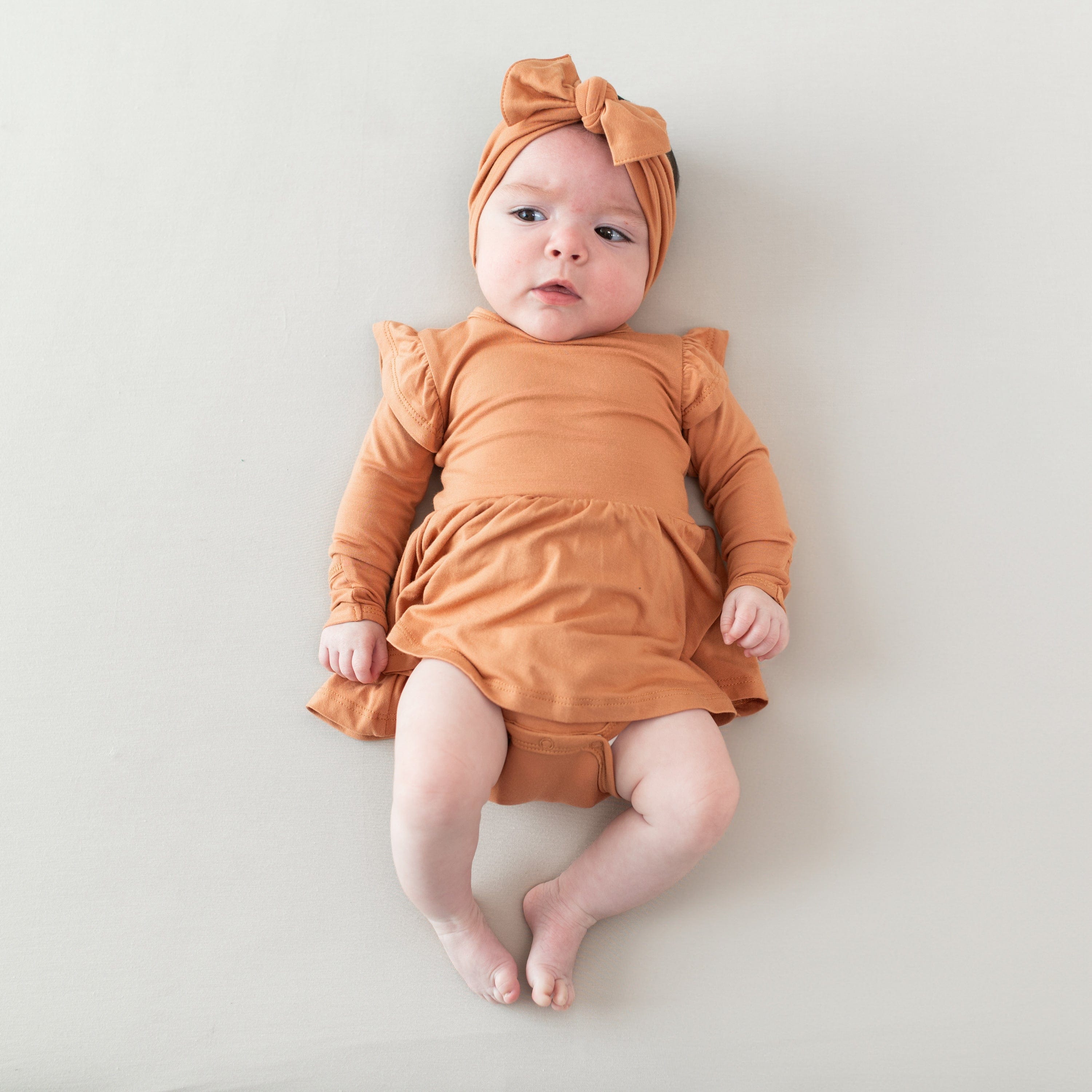 Kyte Baby LS Twirl Bodysuit Dress Long Sleeve Twirl Bodysuit Dress in Apricot