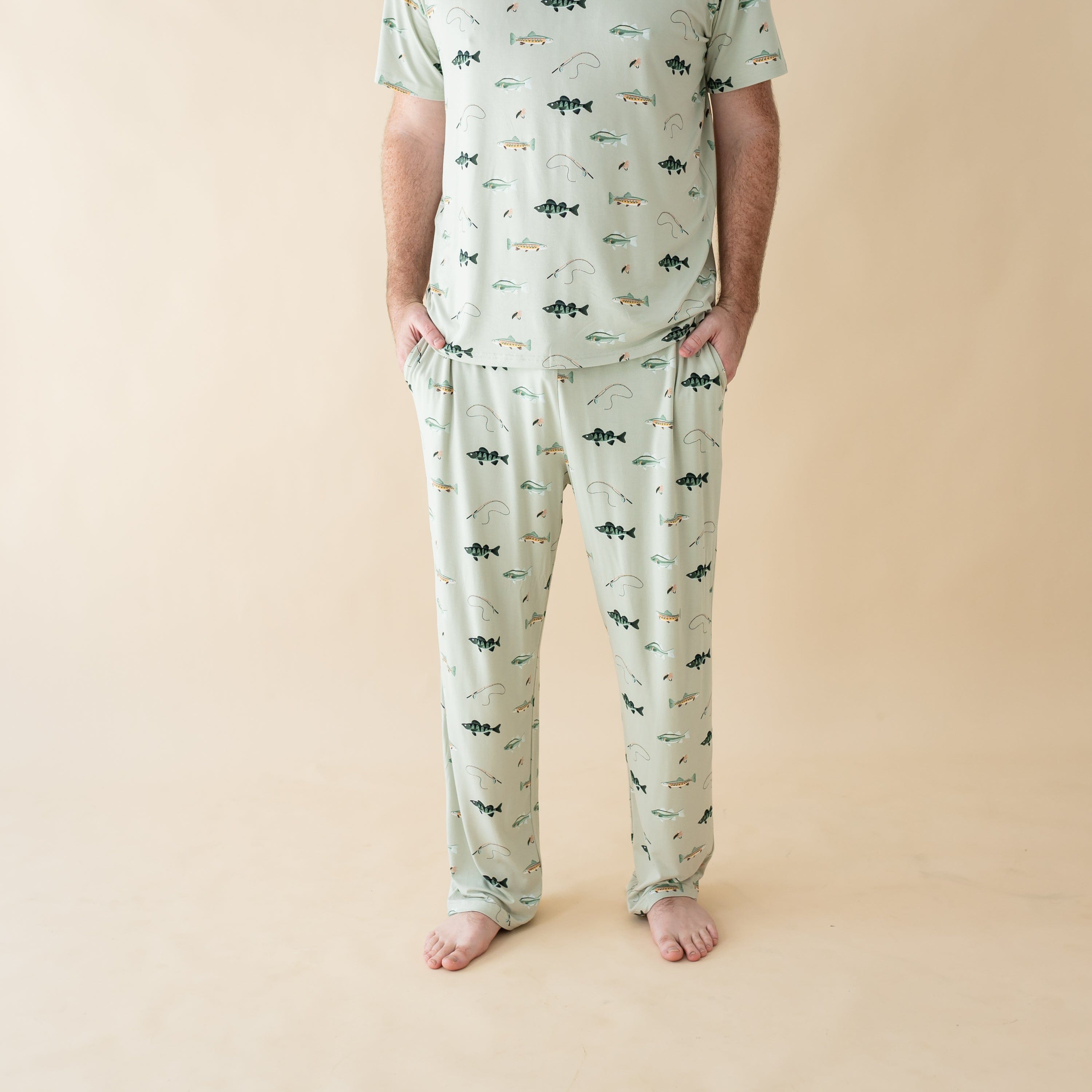 Man wearing Kyte Baby Men's Lounge Pants and matching tee in Fishing