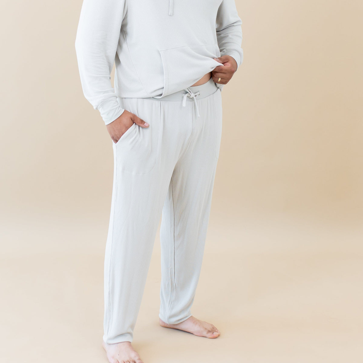 Man wearing Kyte Baby Men's Ribbed Jogger Pant in Oat