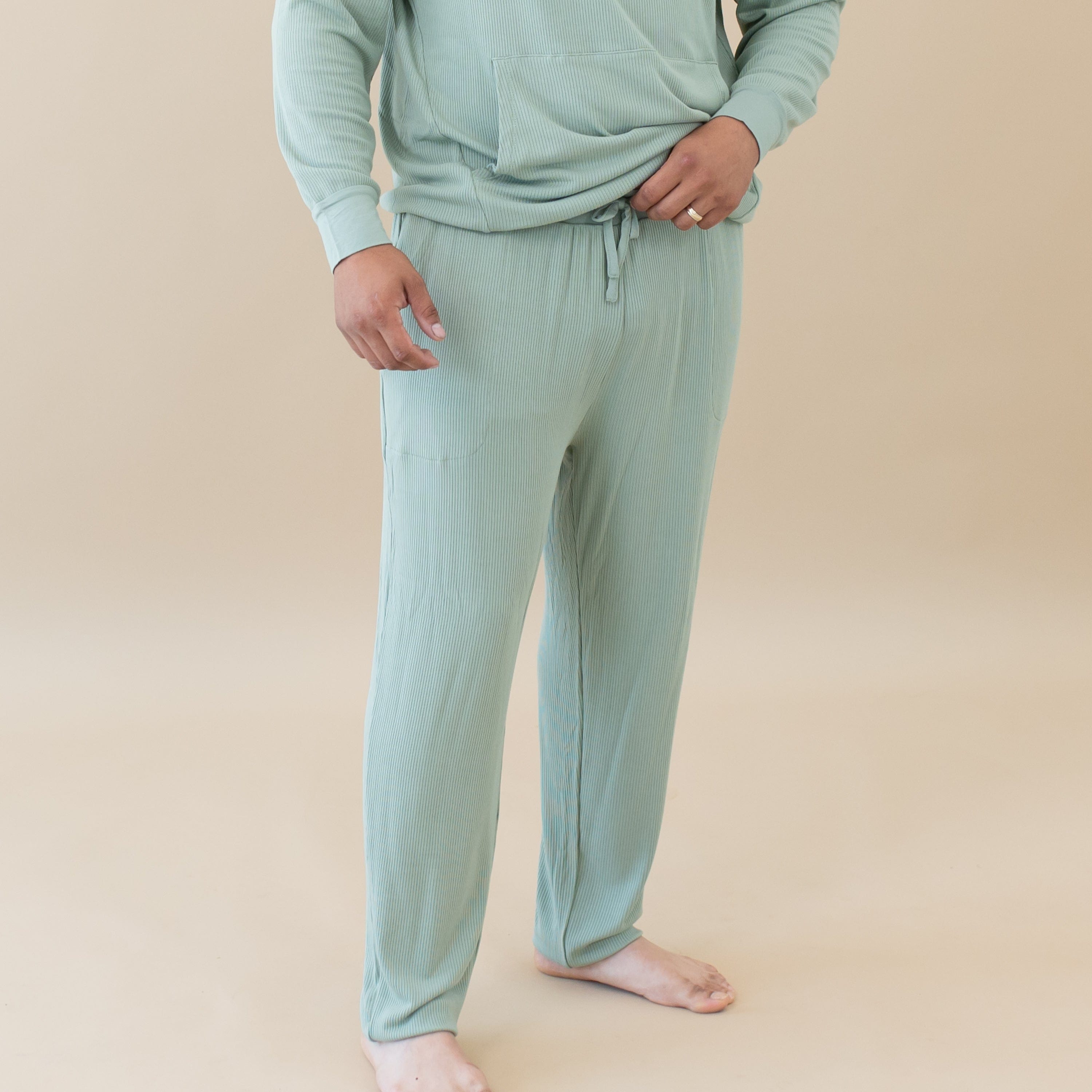 Man wearing Kyte Baby Men's Ribbed Jogger Pant in Thyme