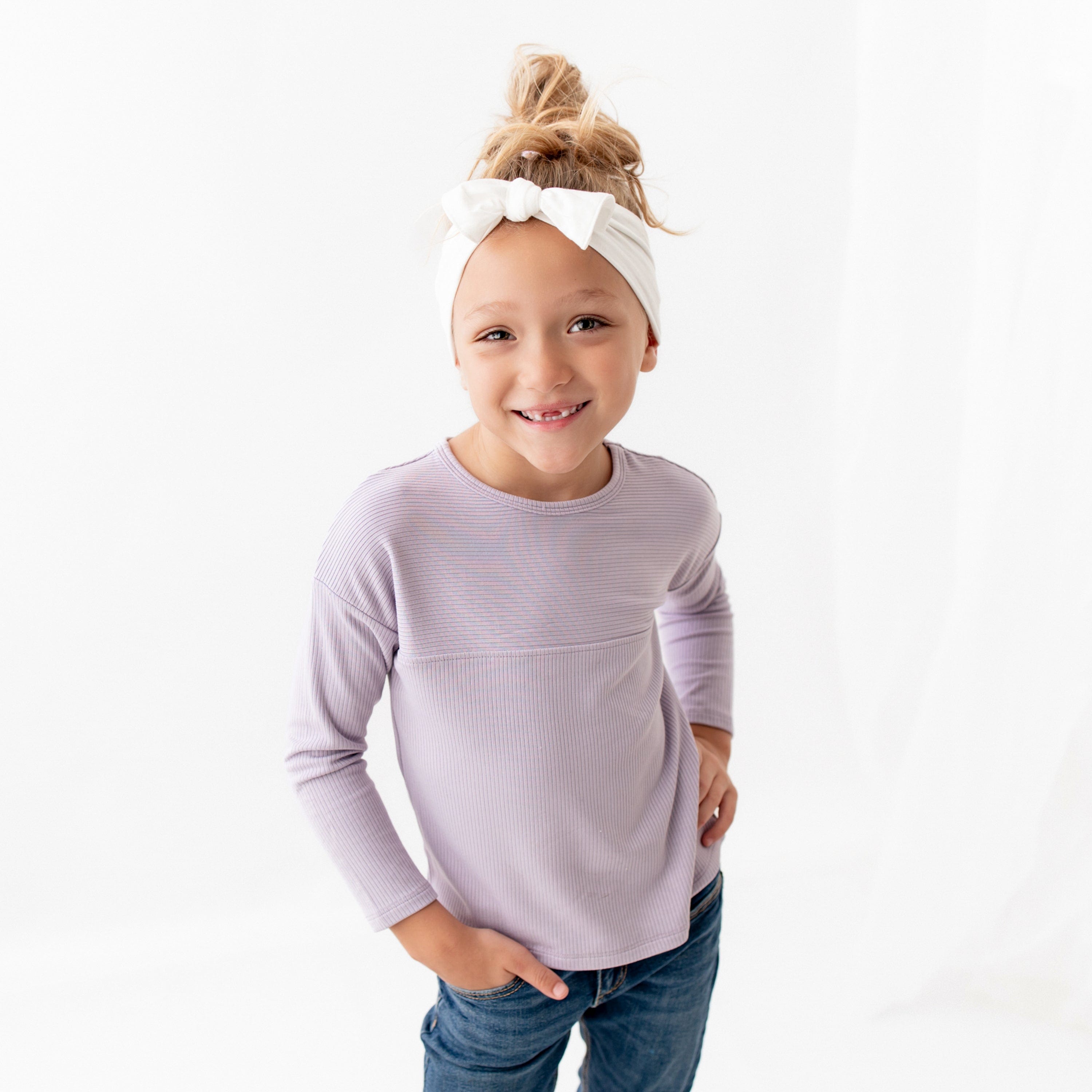 Child wearing Kyte Baby Ribbed Drop Shoulder Top in Taro