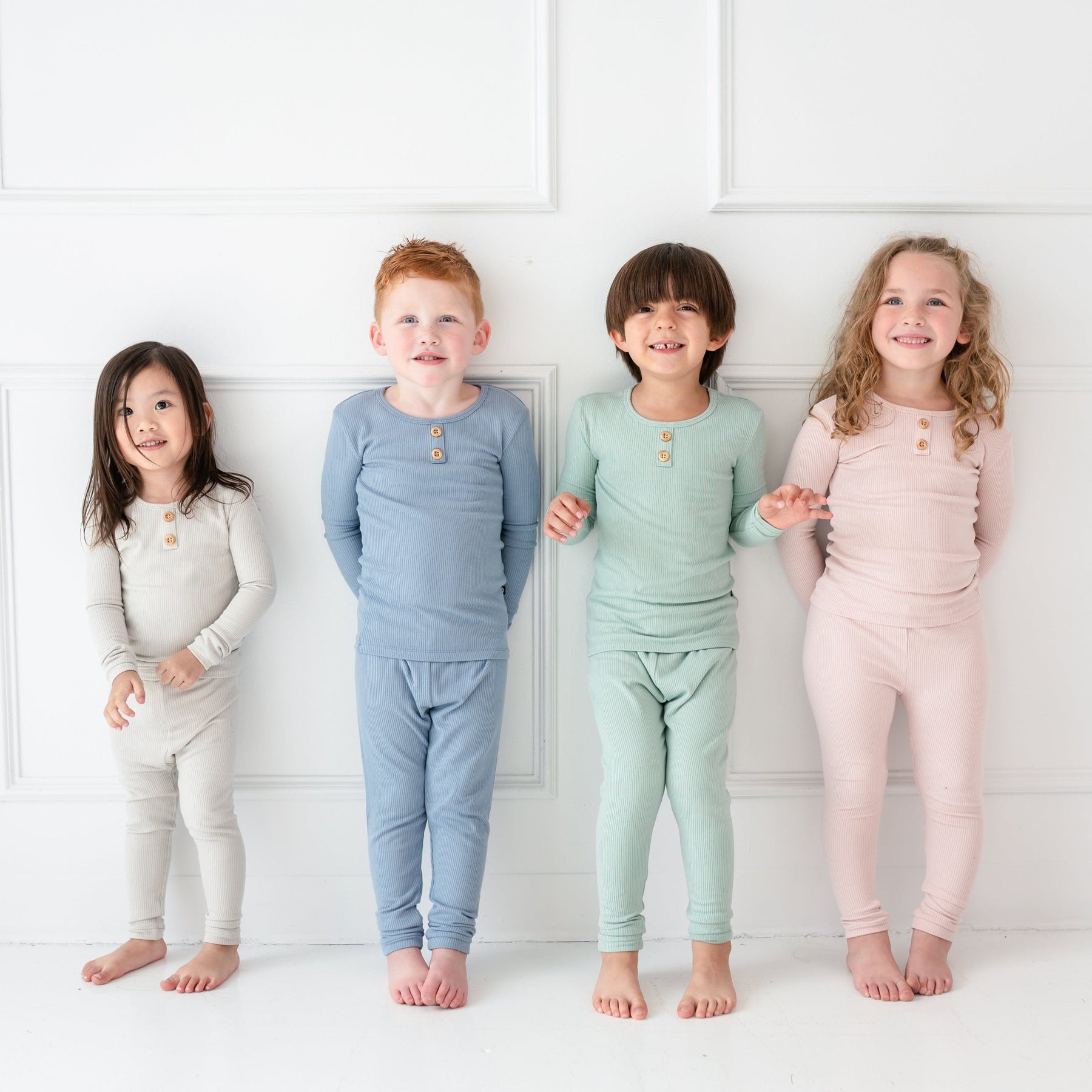 Children wearing Kyte Baby Ribbed Henley Sets