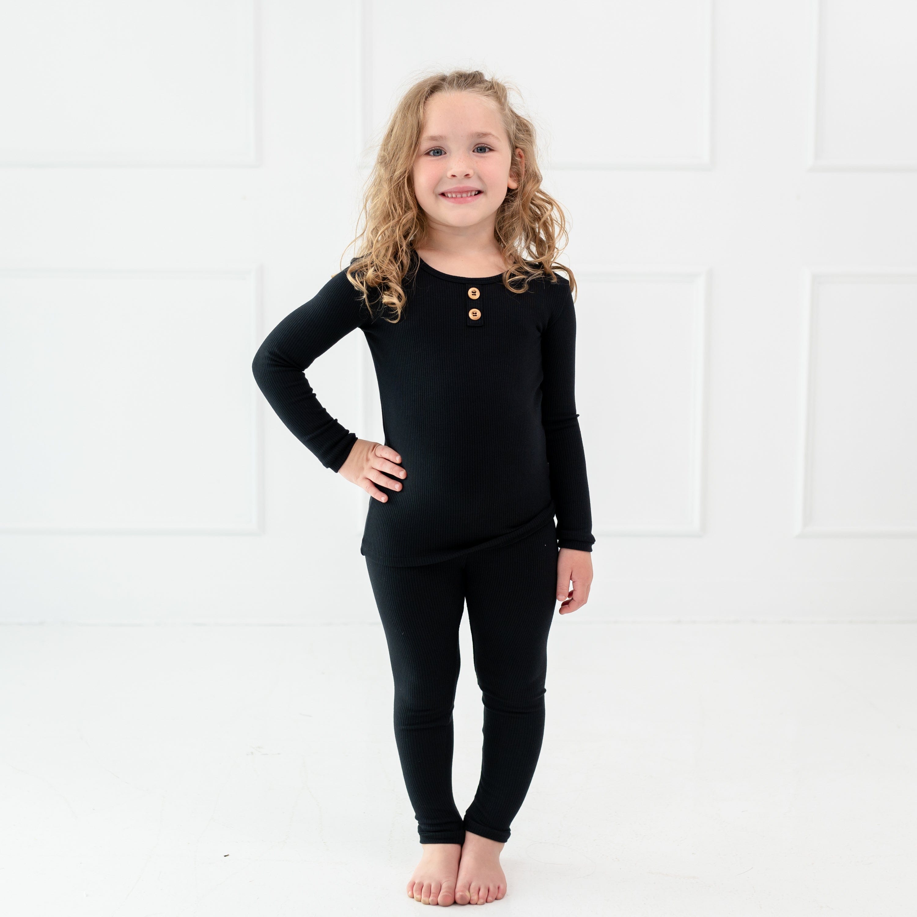 Toddler wearing Kyte Baby Ribbed Henley Set in Midnight with wooden buttons