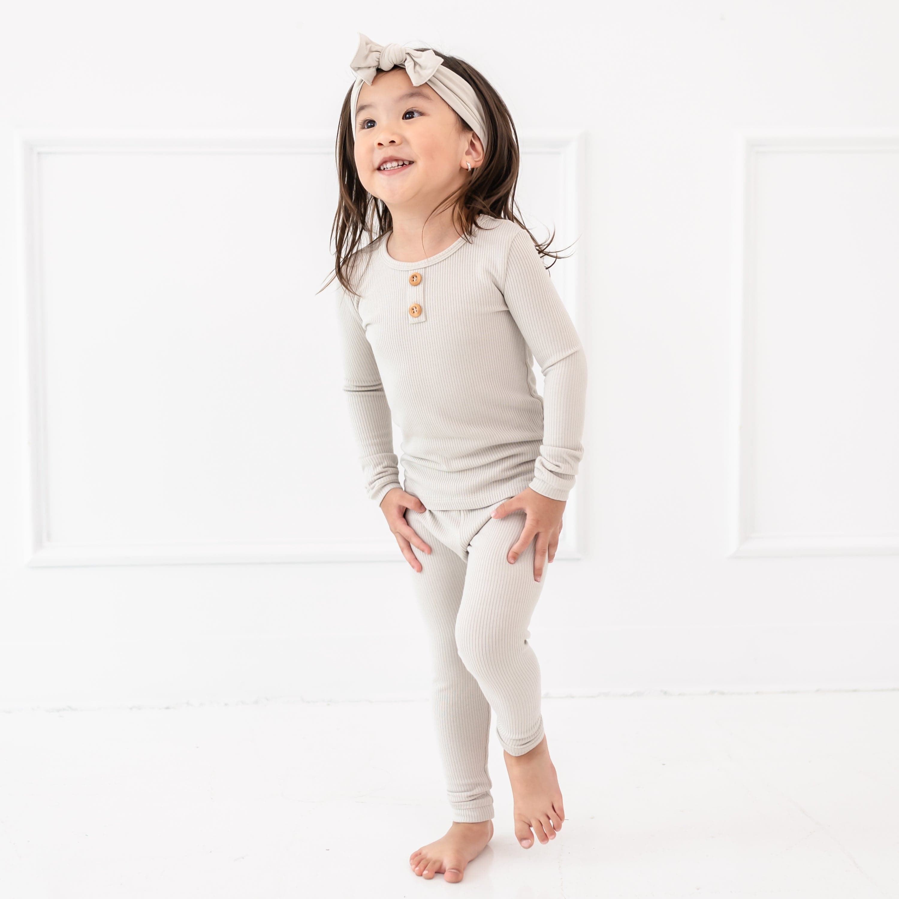 Toddler wearing Kyte Baby Ribbed Henley Set in Oat