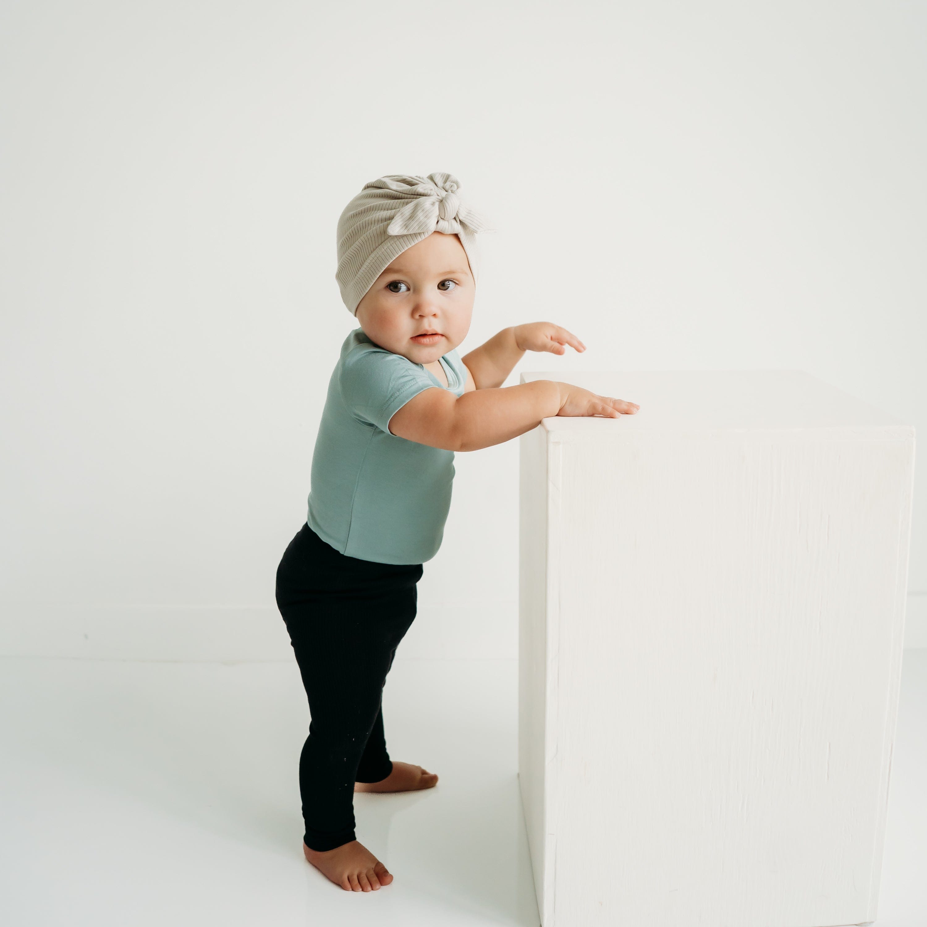 Child Wearing Kyte Baby Ribbed Leggings with Elastic Waist in Midnight