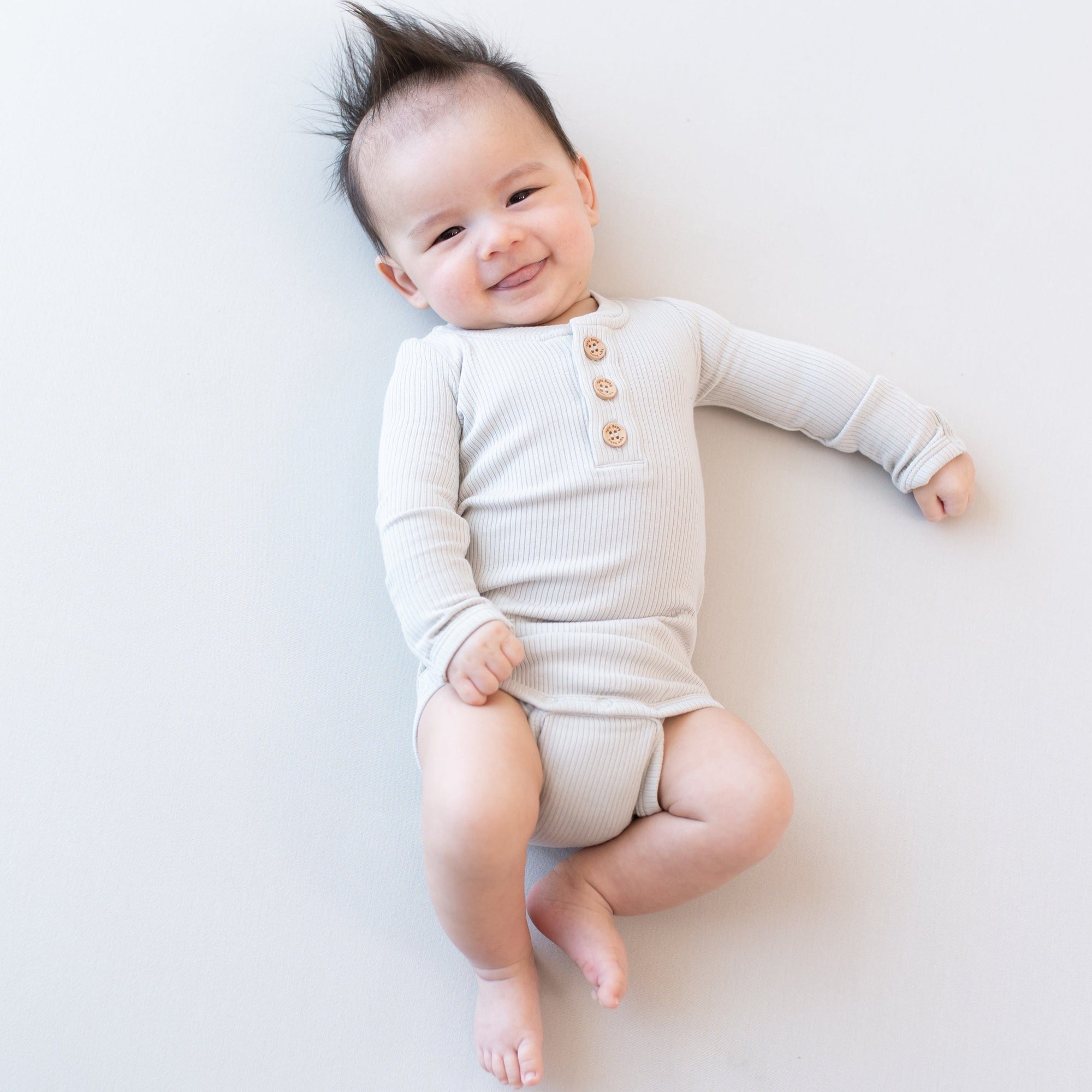 Baby in Ribbed Long Sleeve Henley Bodysuit Ribbed in Oat