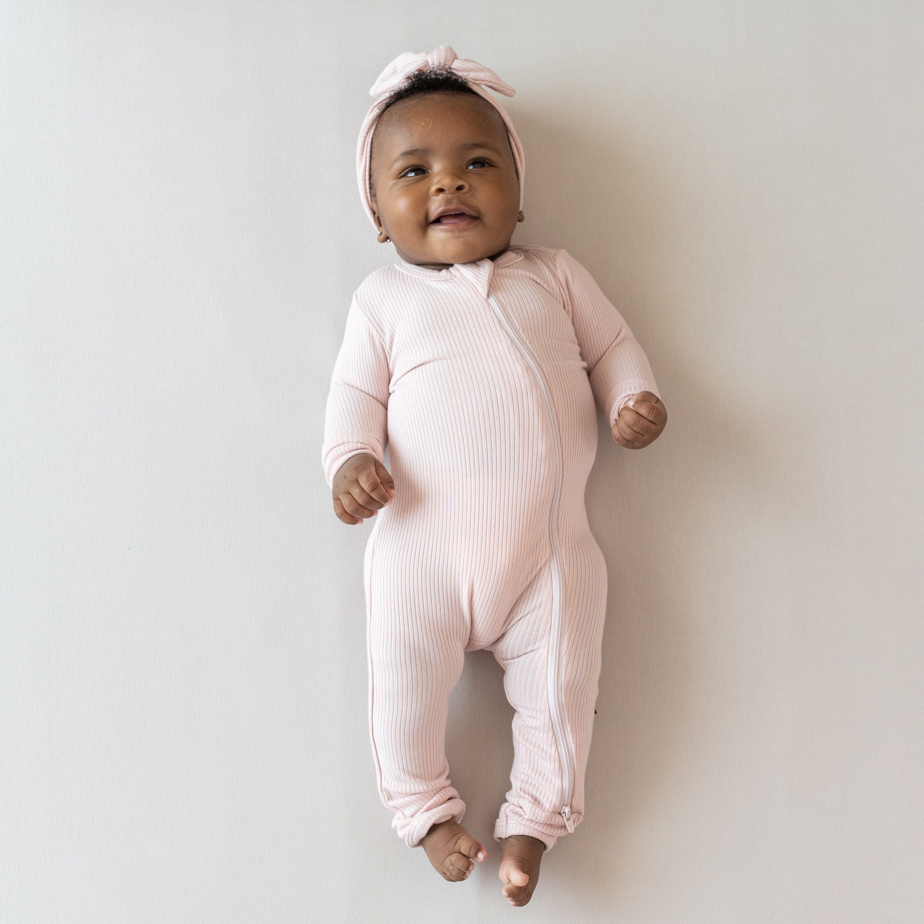 Ribbed Zipper Romper in Blush Bamboo Romper Kyte Baby