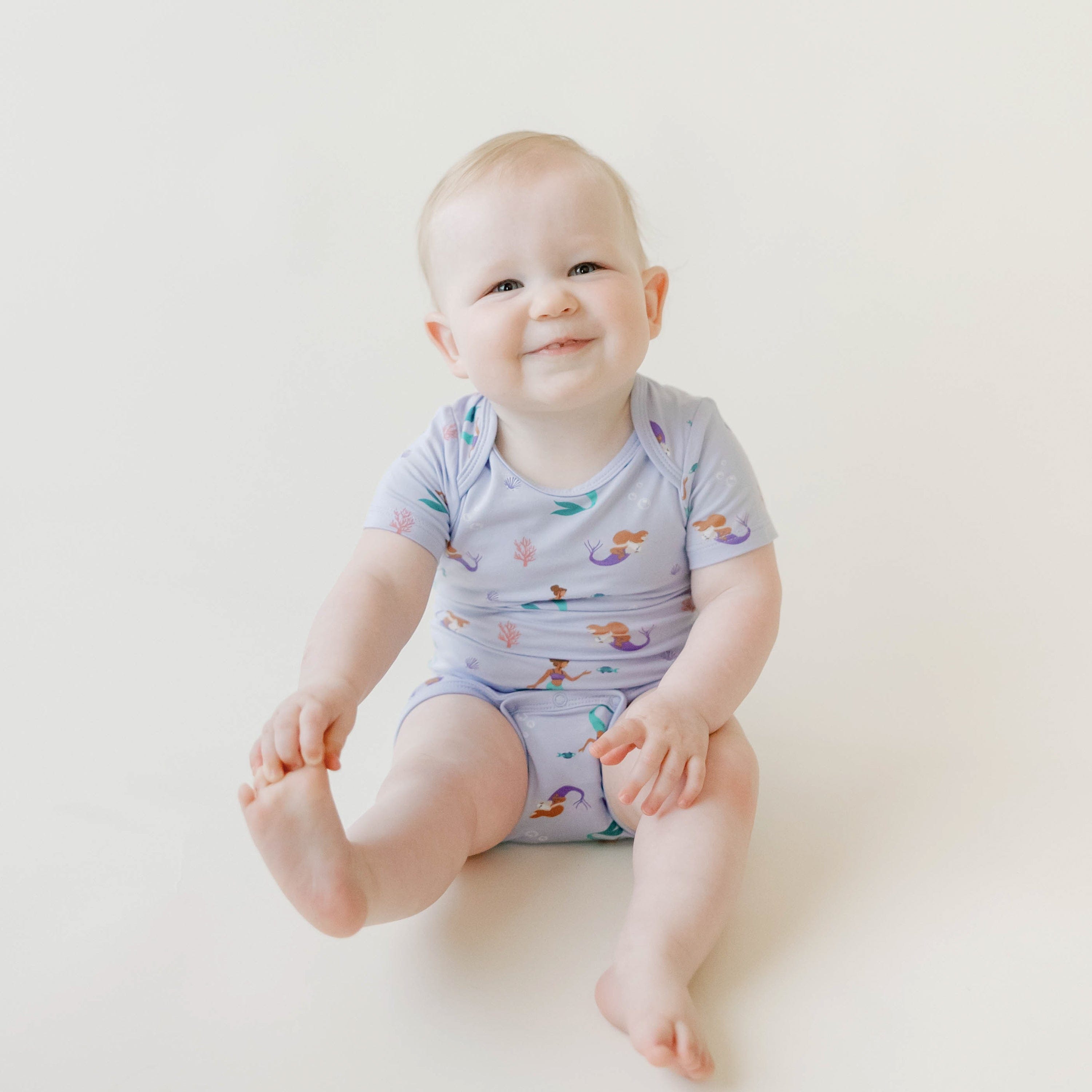 Kyte Baby Short factory Sleeve Bodysuit Creek 12-18m