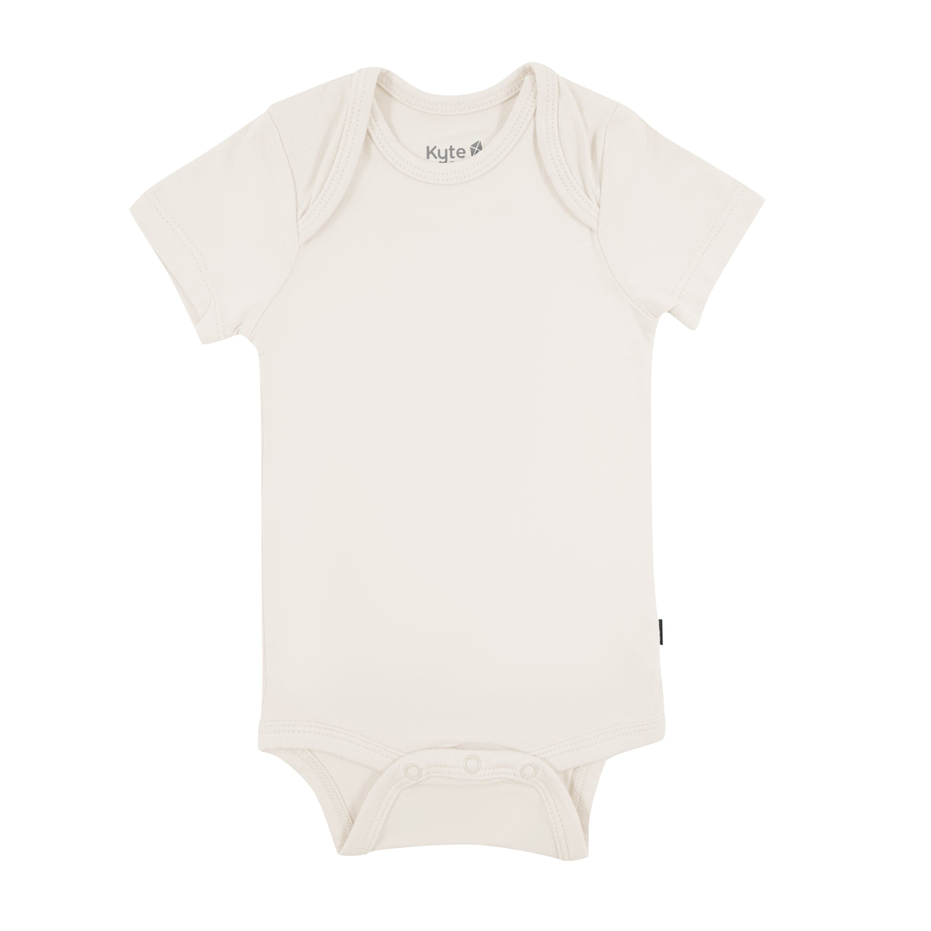 Flat lay of Kyte Baby Bodysuit in Oat