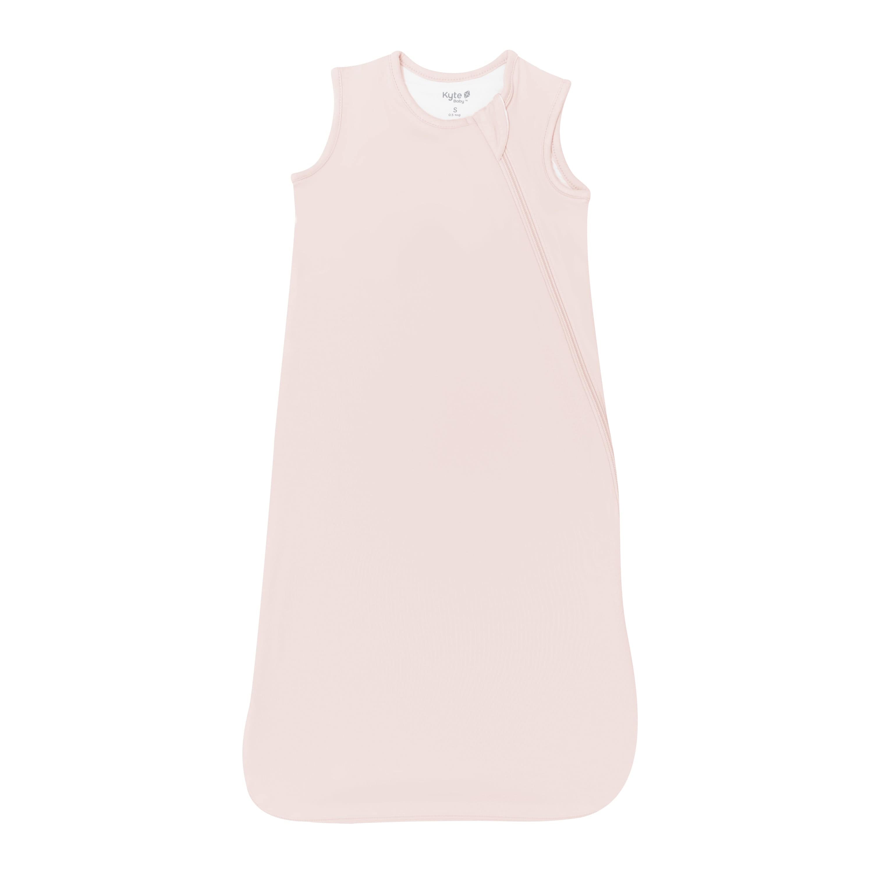 Flat lay photo of a Kyte Baby Sleep Bag in Blush 0.5