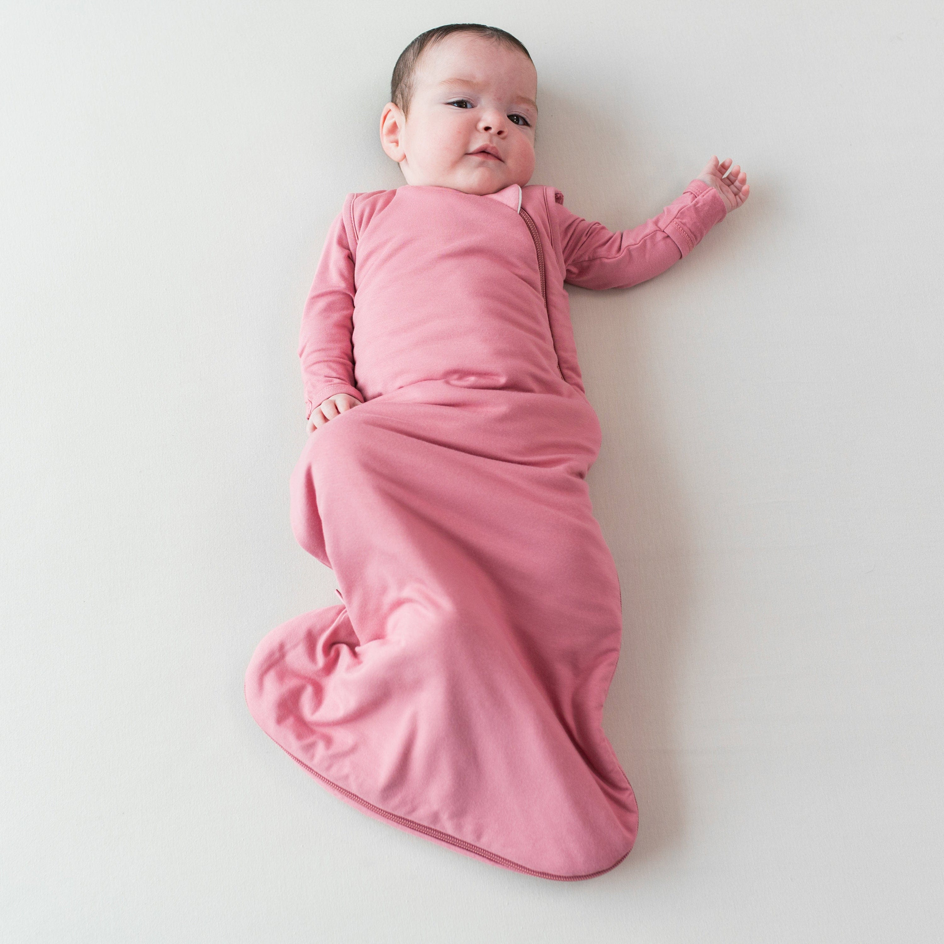 Baby wearing Pink Sleep Bag in Apple Blossom TOG 1.0
