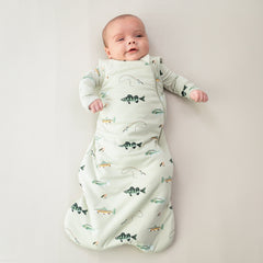 Infant wearing Kyte Baby Sleep Bag in Fishing 1.0