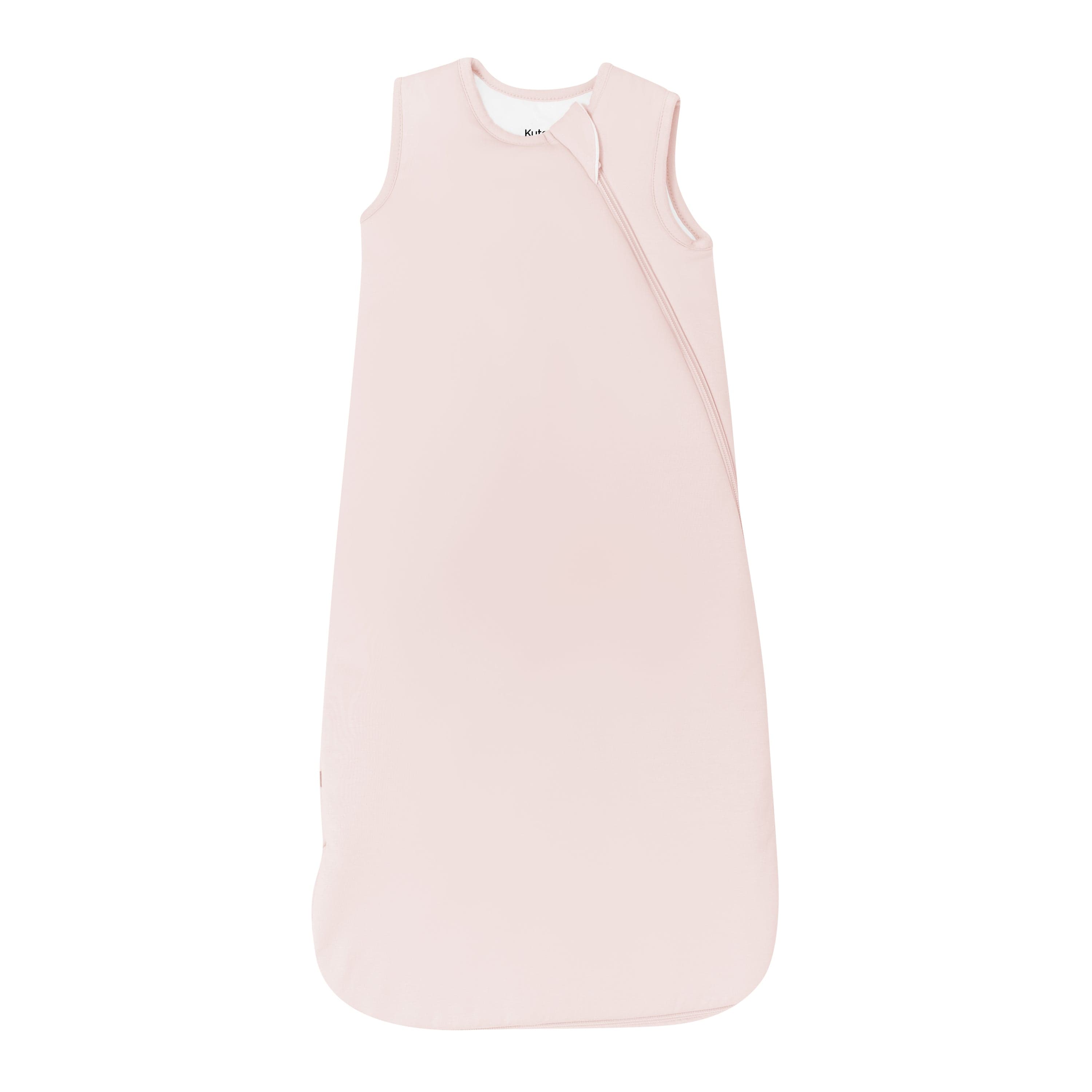 Flay lay of Kyte Baby Sleep Bag in Blush 2.5