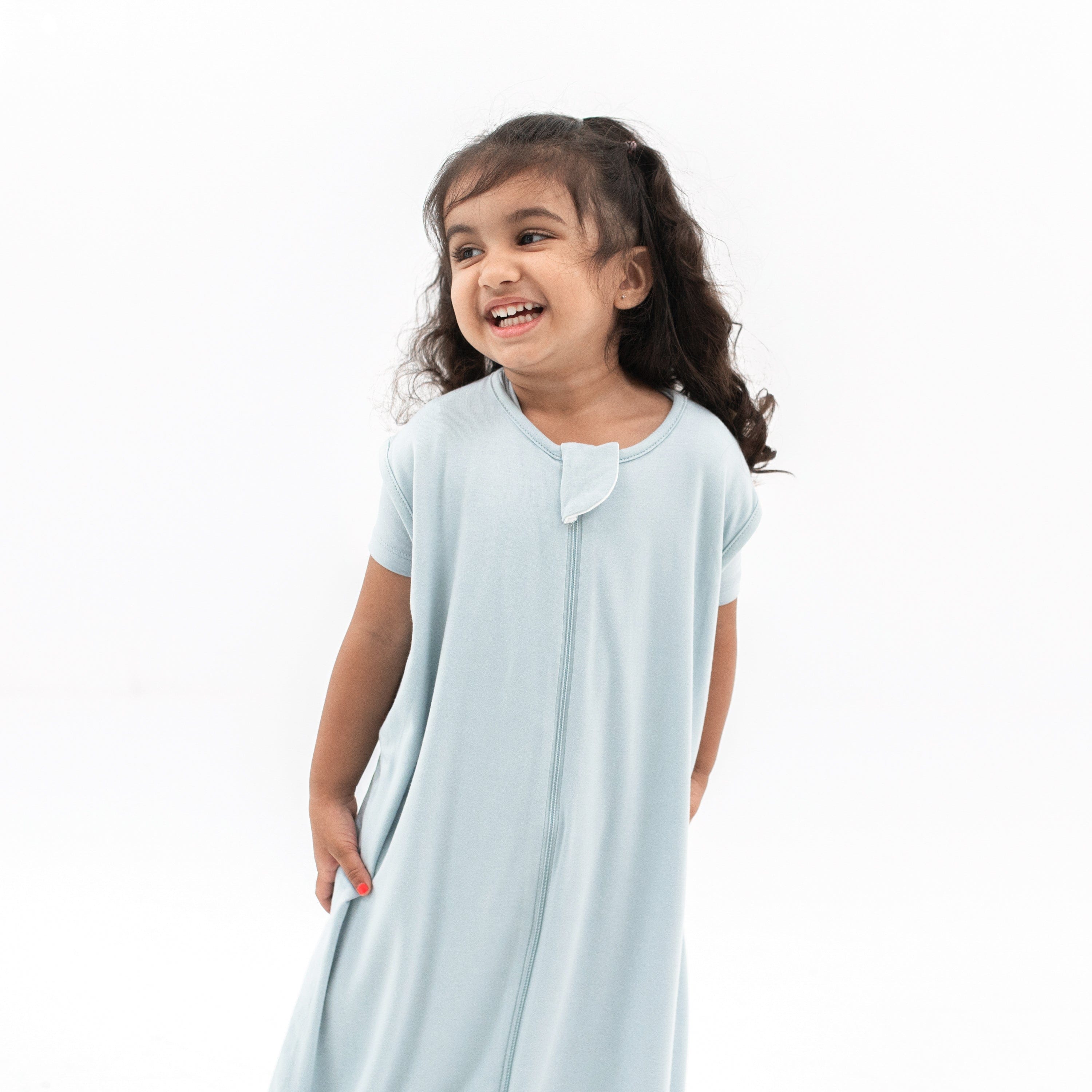 Close up of smiling girl wearing the Sleep Bag Walker in Fog 0.5