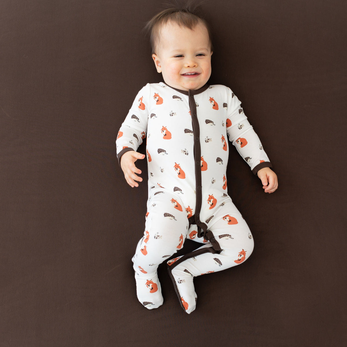 Kyte Baby Snap Footies Footie in Sienna Woodland