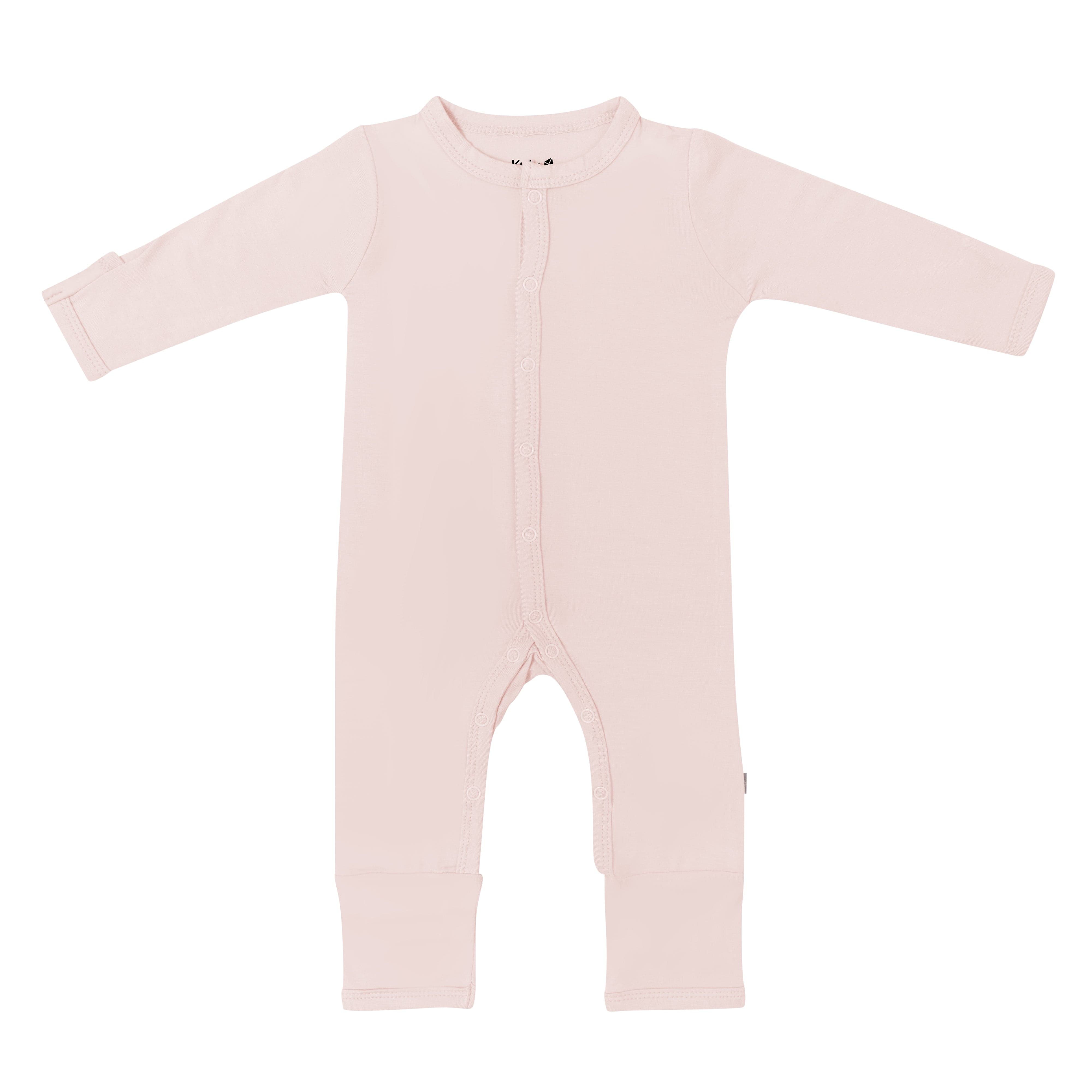 Flat lay of Kyte Baby Romper in Blush
