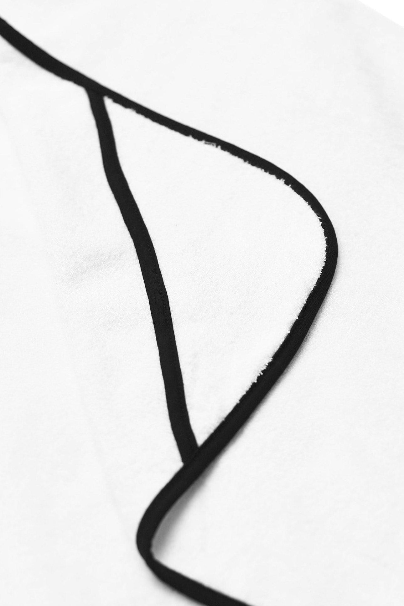 Pocket inserts on Kyte Baby Toddler Hooded Bath Towel in Cloud with Midnight Trim