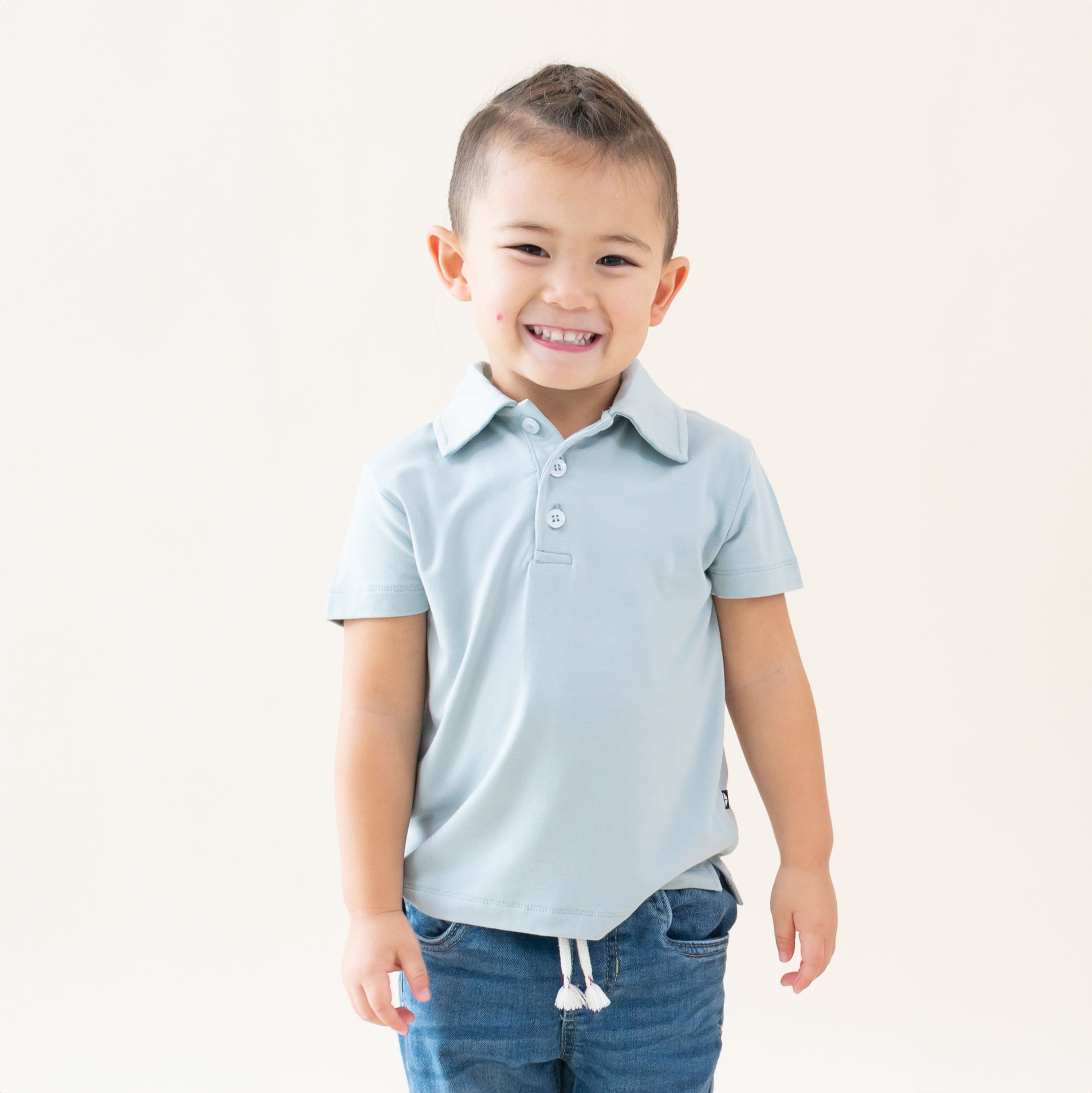 Toddler wearing Kyte Baby Short Sleeve Polo in Fog