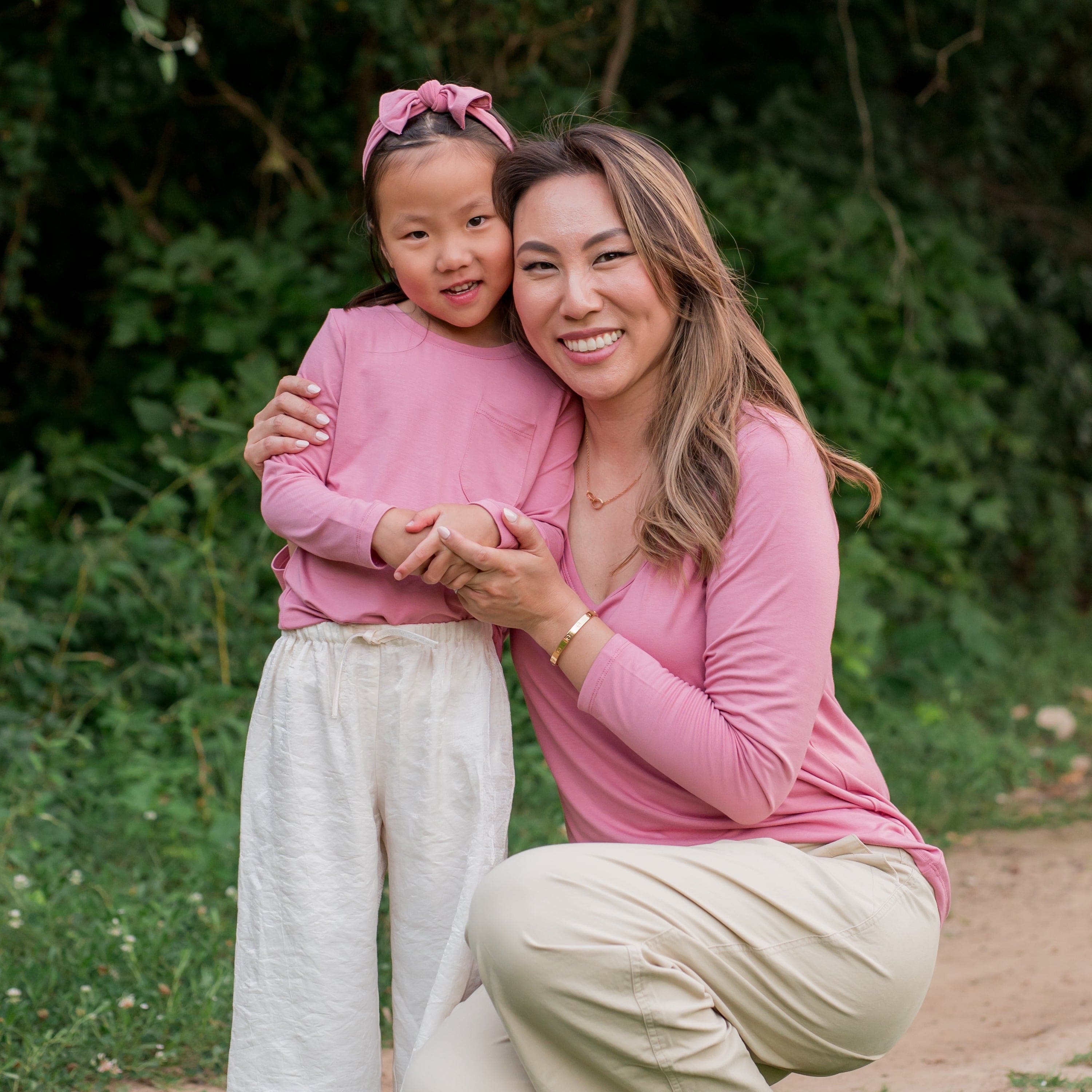 Mom and Daughter wearing matching Kyte Baby Long Sleeve Tees in Apple Blossom