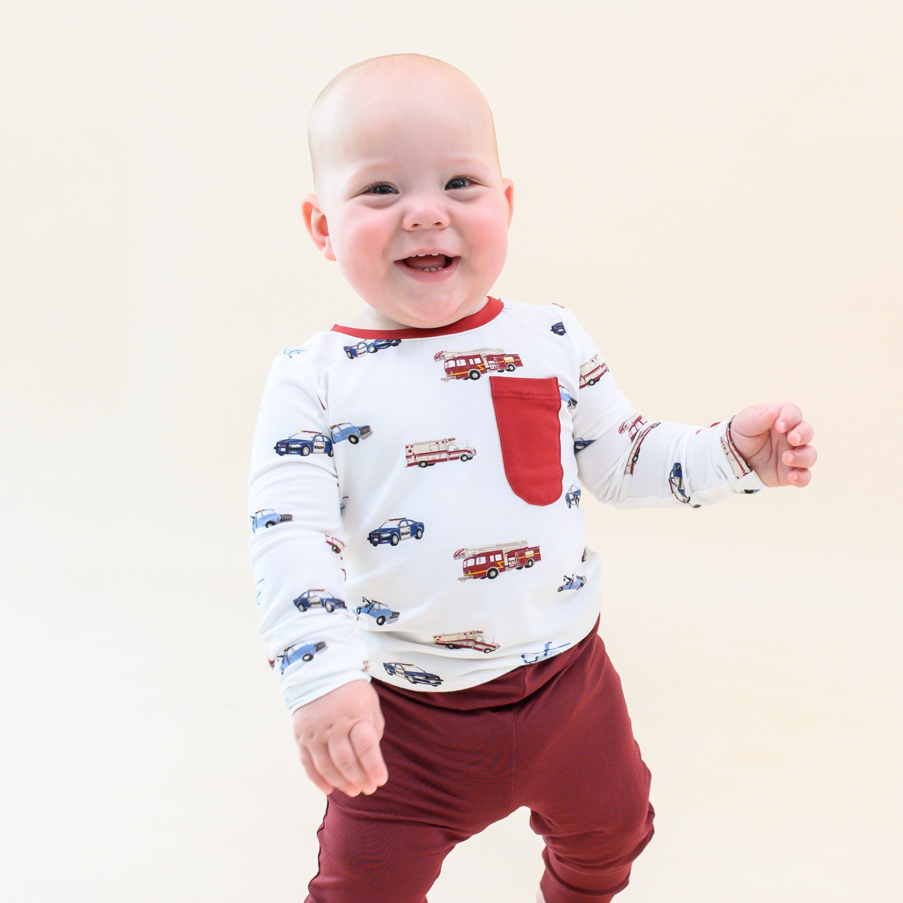 Toddler wearing Kyte Baby Long Sleeve Crew Neck Tee in First Responder