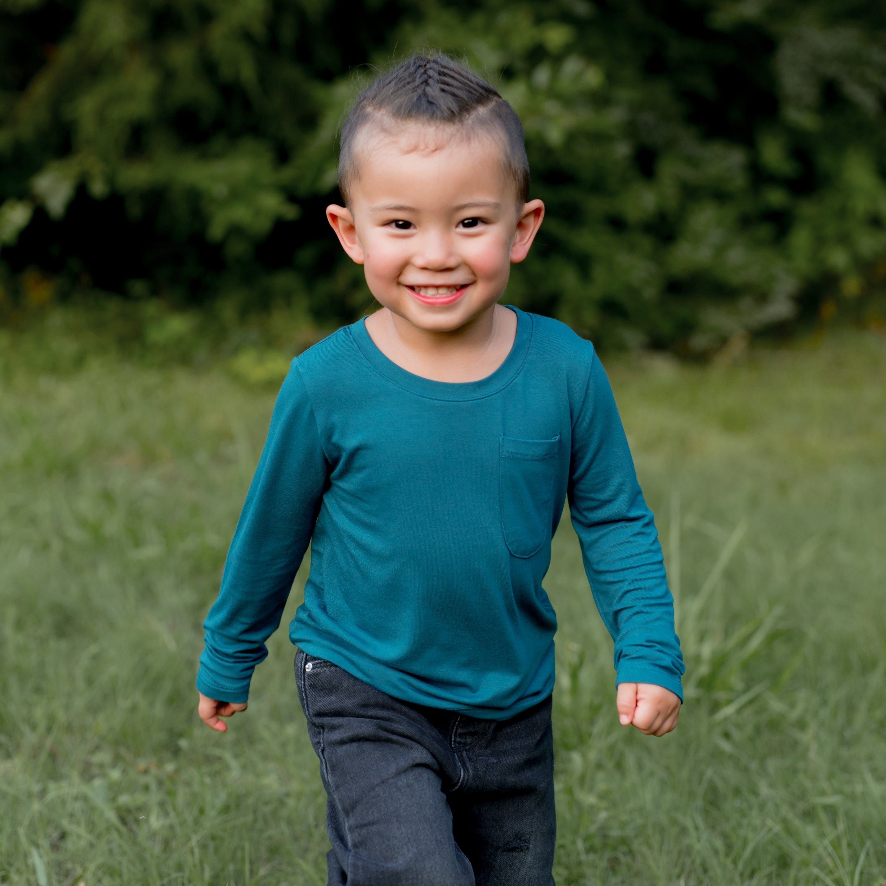 Toddler wearing Kyte Baby Long Sleeve Crew Neck Tee in Loch