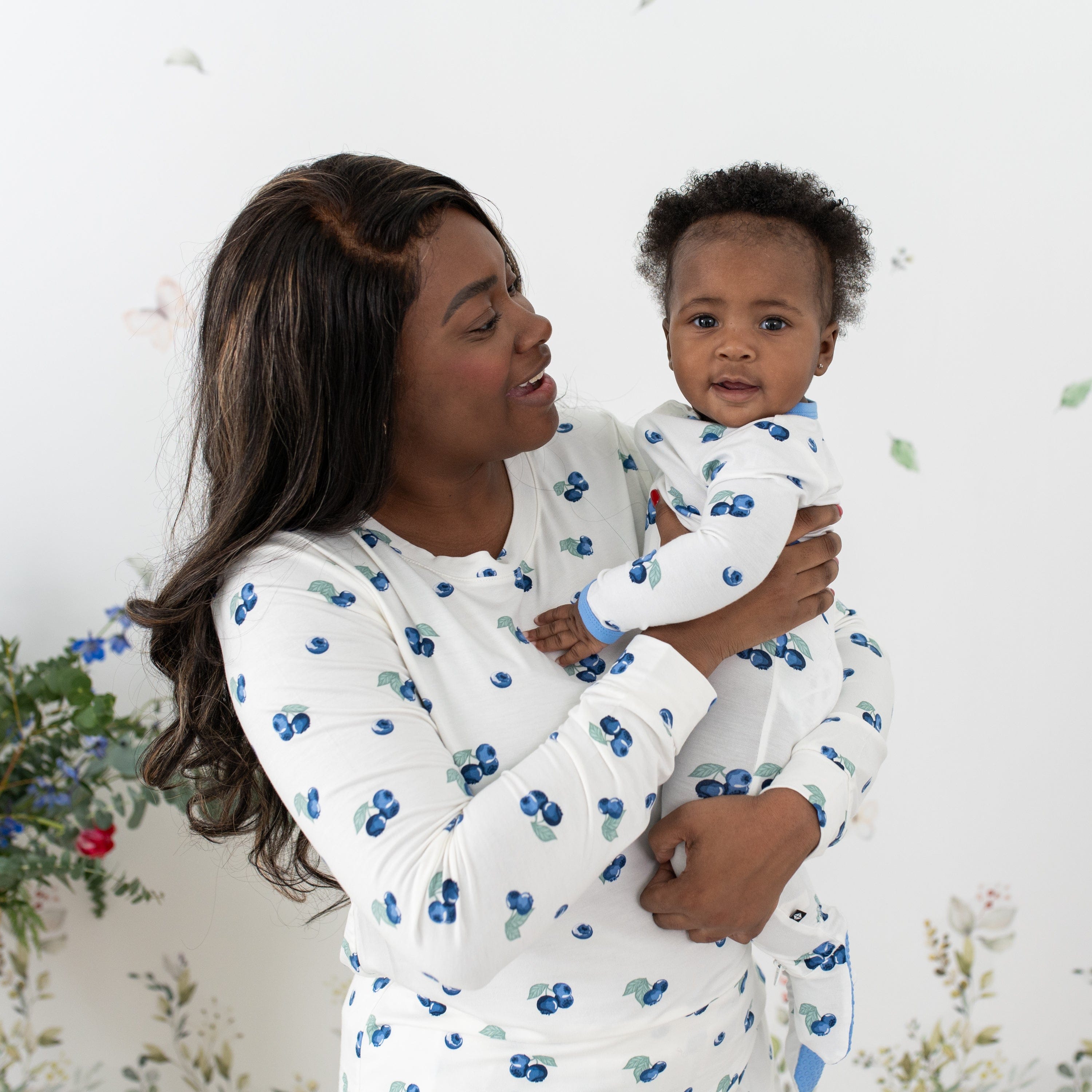 Mother and daughter wearing Kyte Baby matching pajamas in Blueberry