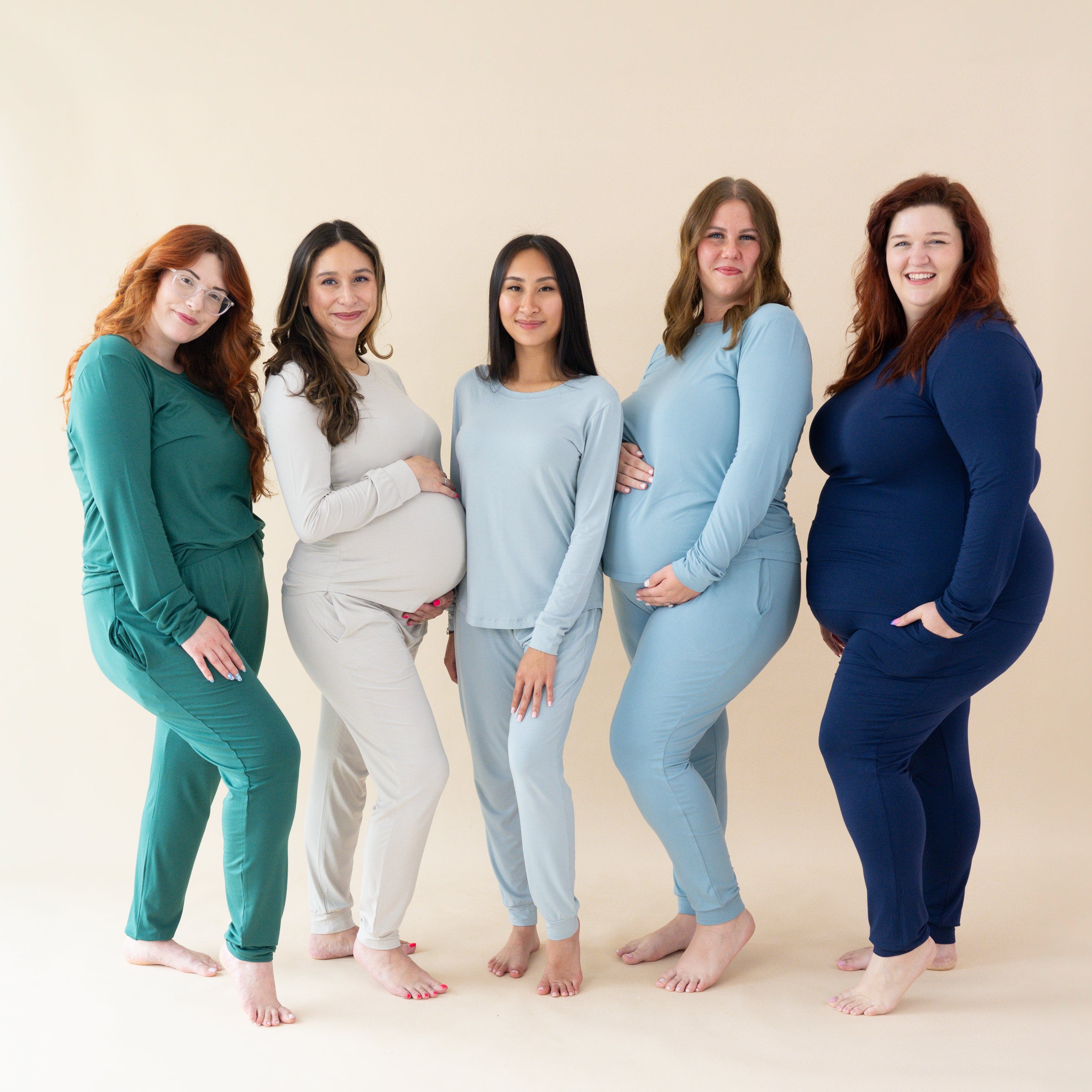 Women wearing Kyte Baby women's jogger pajama set in core colors