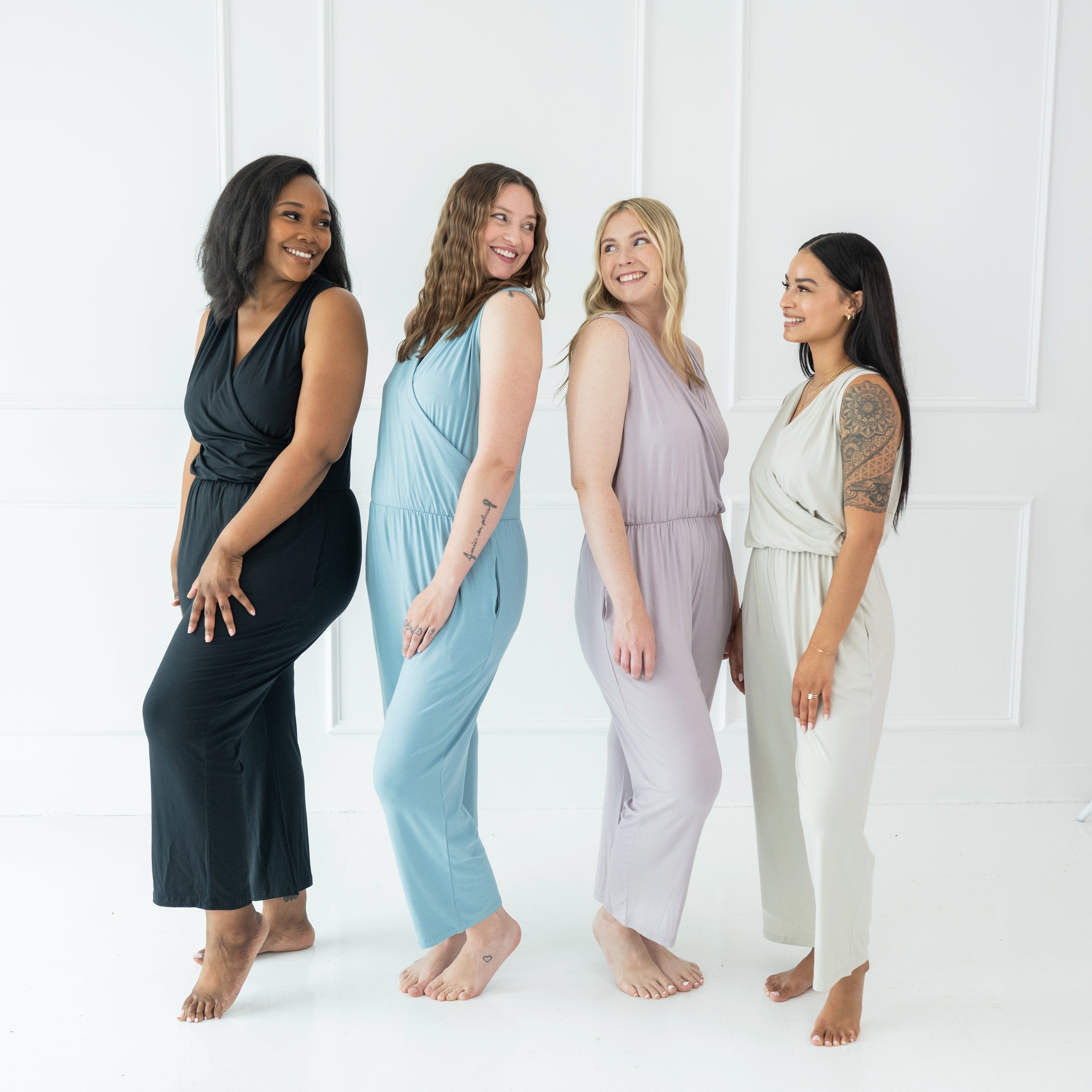 Women wearing Kyte Baby Women's sleeveless jumpsuits with pockets